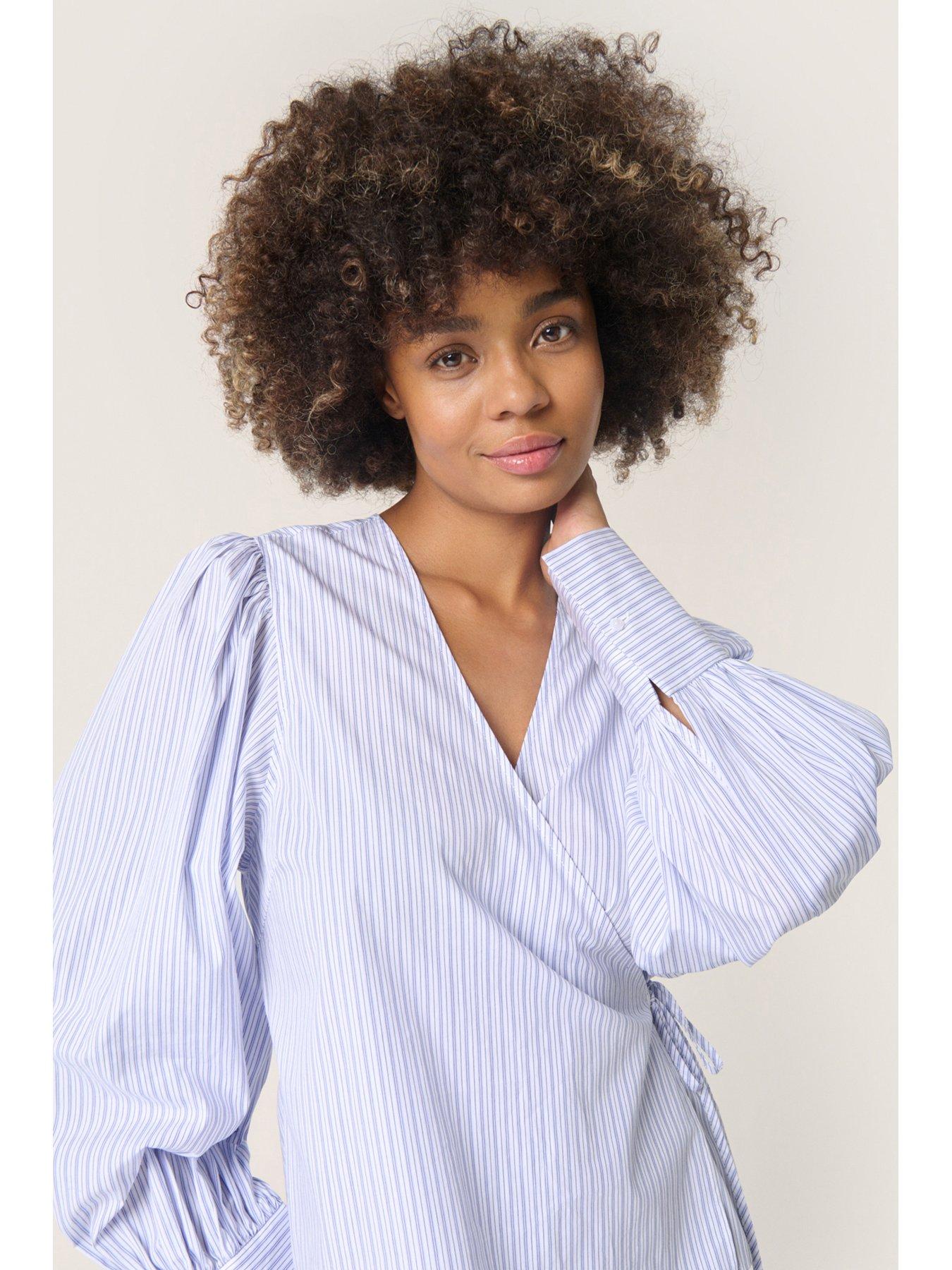  image of soaked-in-luxury-oriana-wrap-blouse-blue