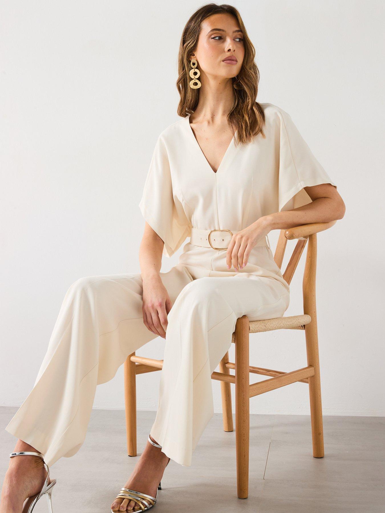  image of mango-long-jumpsuit-with-belt-and-buckle-cream