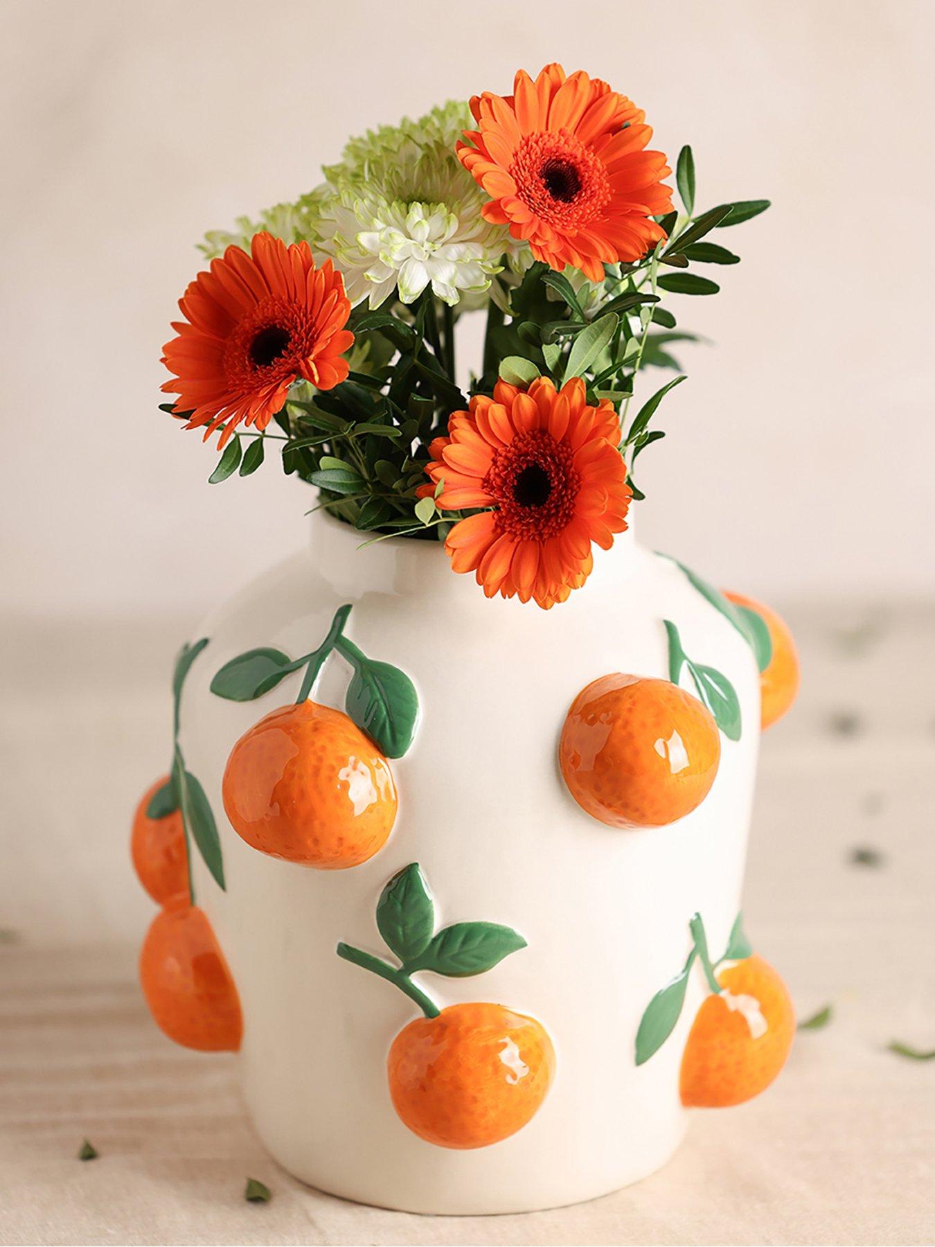 hestia-white-vase-with-oranges