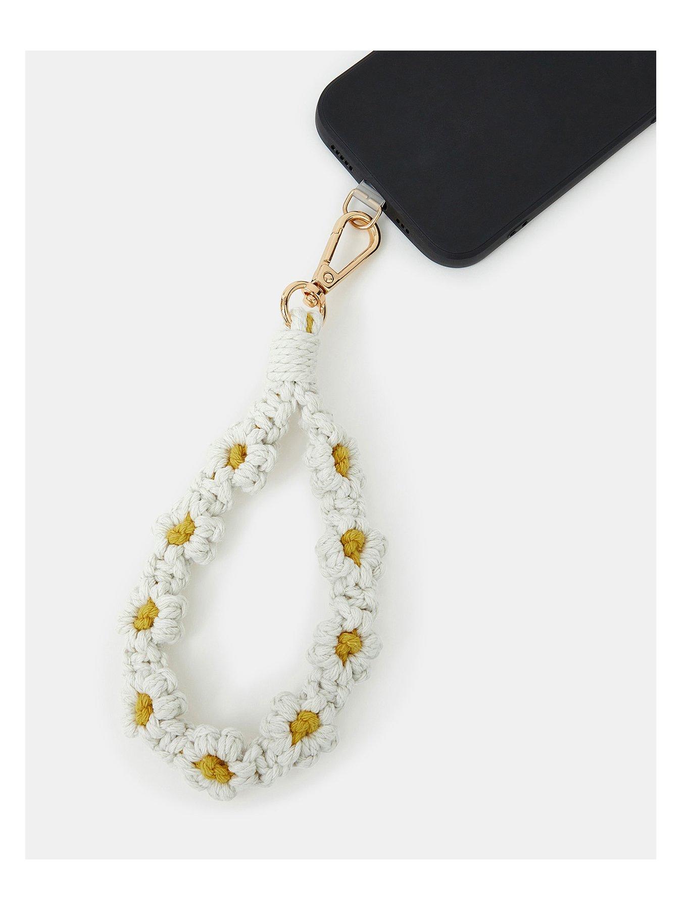  image of accessorize-macrame-daisy-phone-wrist-strap-cream