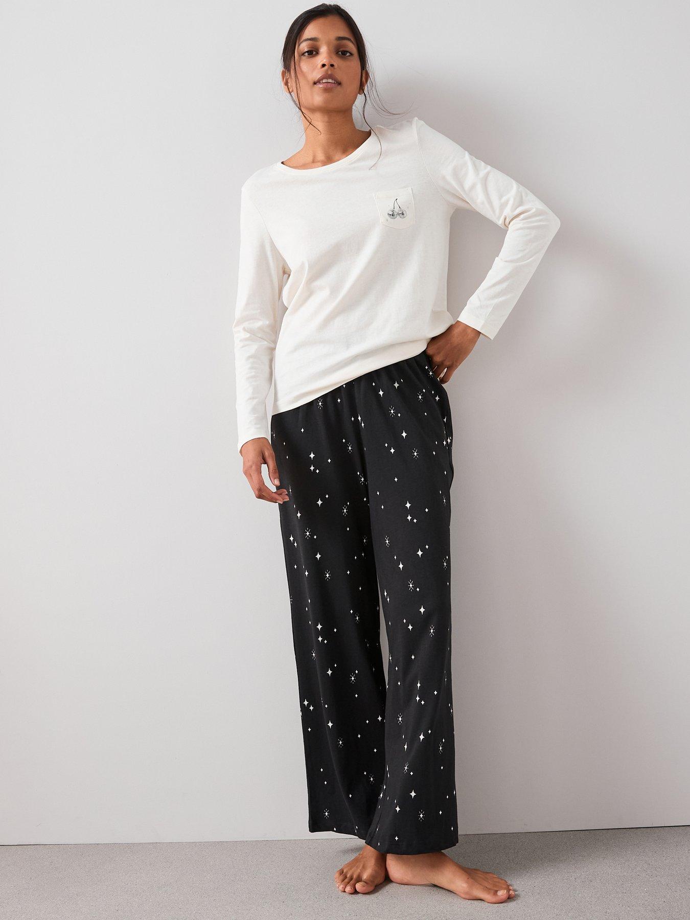 front image of the-very-collection-long-sleeve-tshirt-disco-ball-pocket-detail-with-wide-leg-pj-set-white