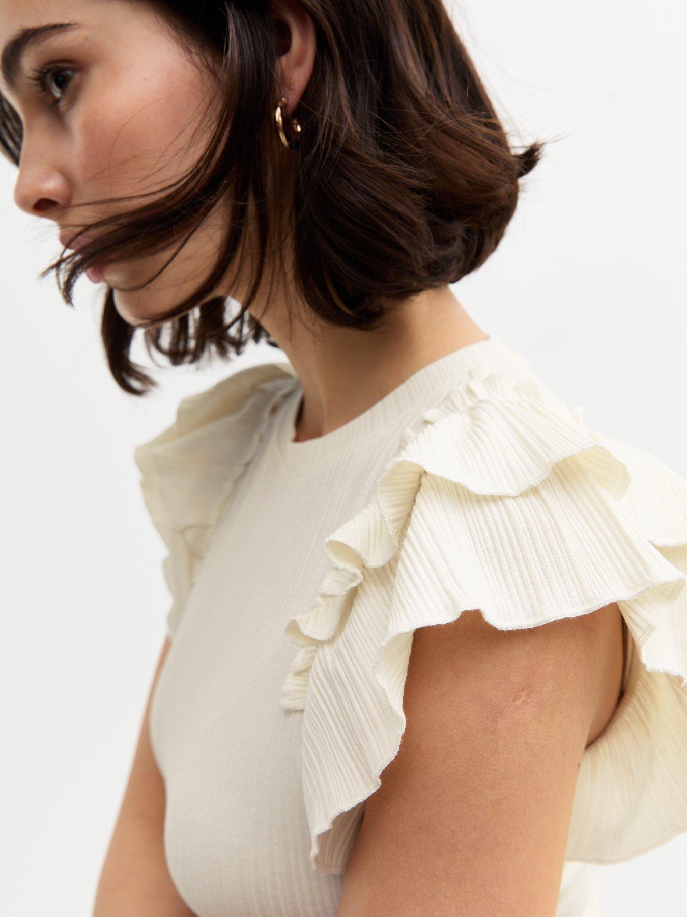  image of new-look-ruffle-trim-rib-jersey-vest-cream