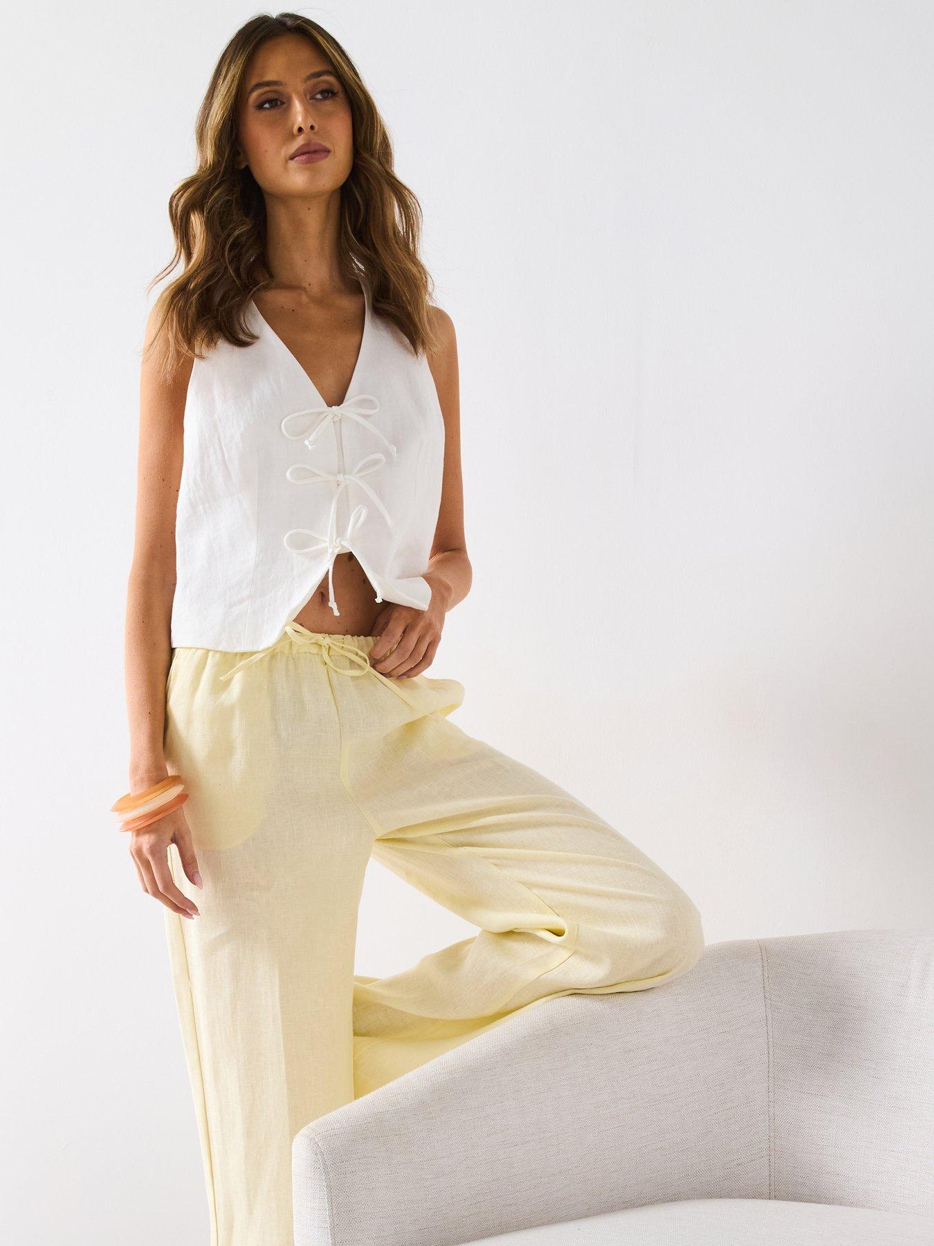  image of mango-straight-linen-pants-with-bow-yellow