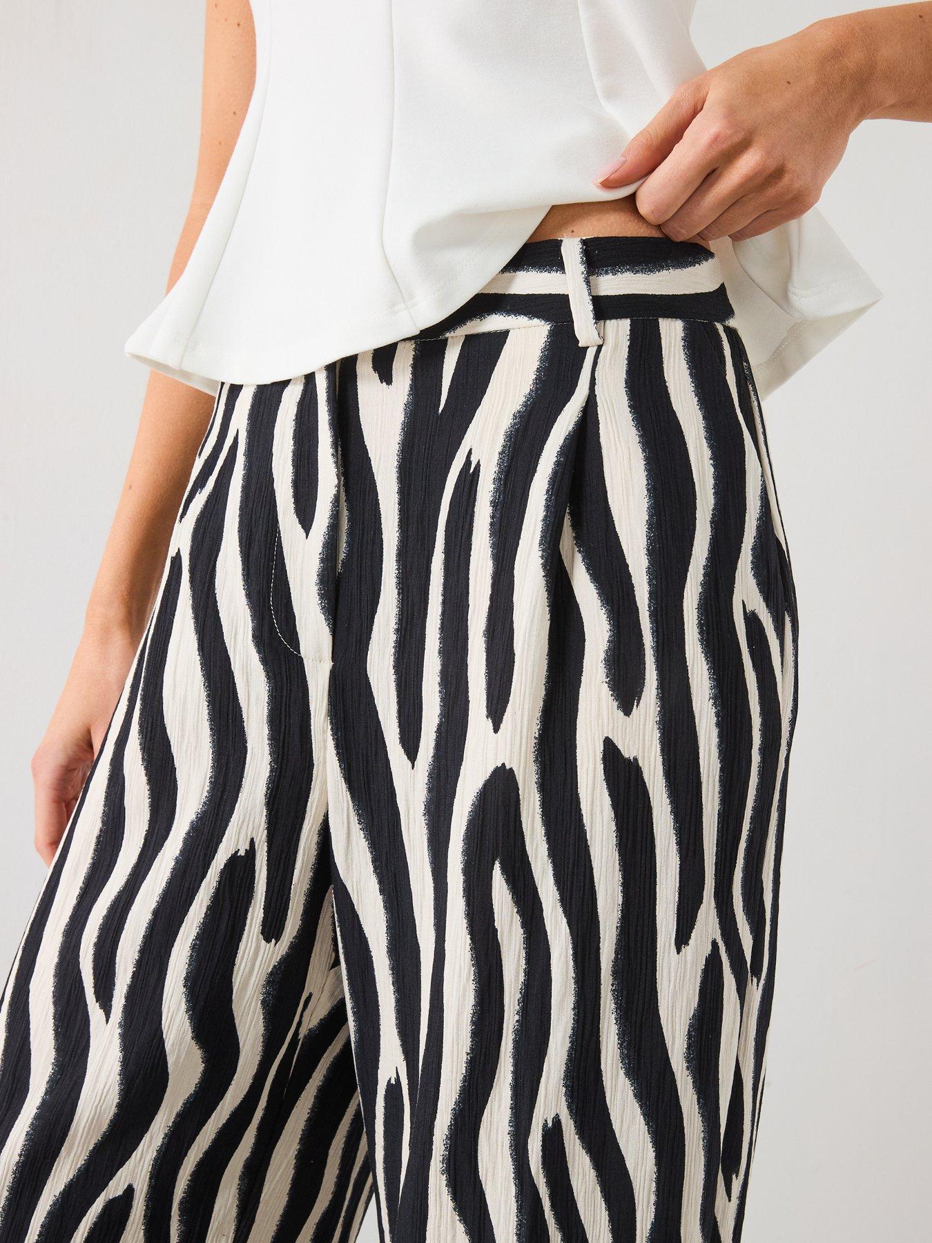  image of mango-zebra-print-straight-fit-trousers-black