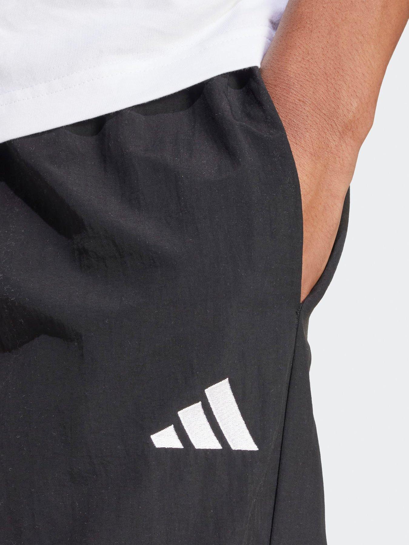  image of adidas-sportswear-mens-essential-small-logo-woven-open-hem-pant-black