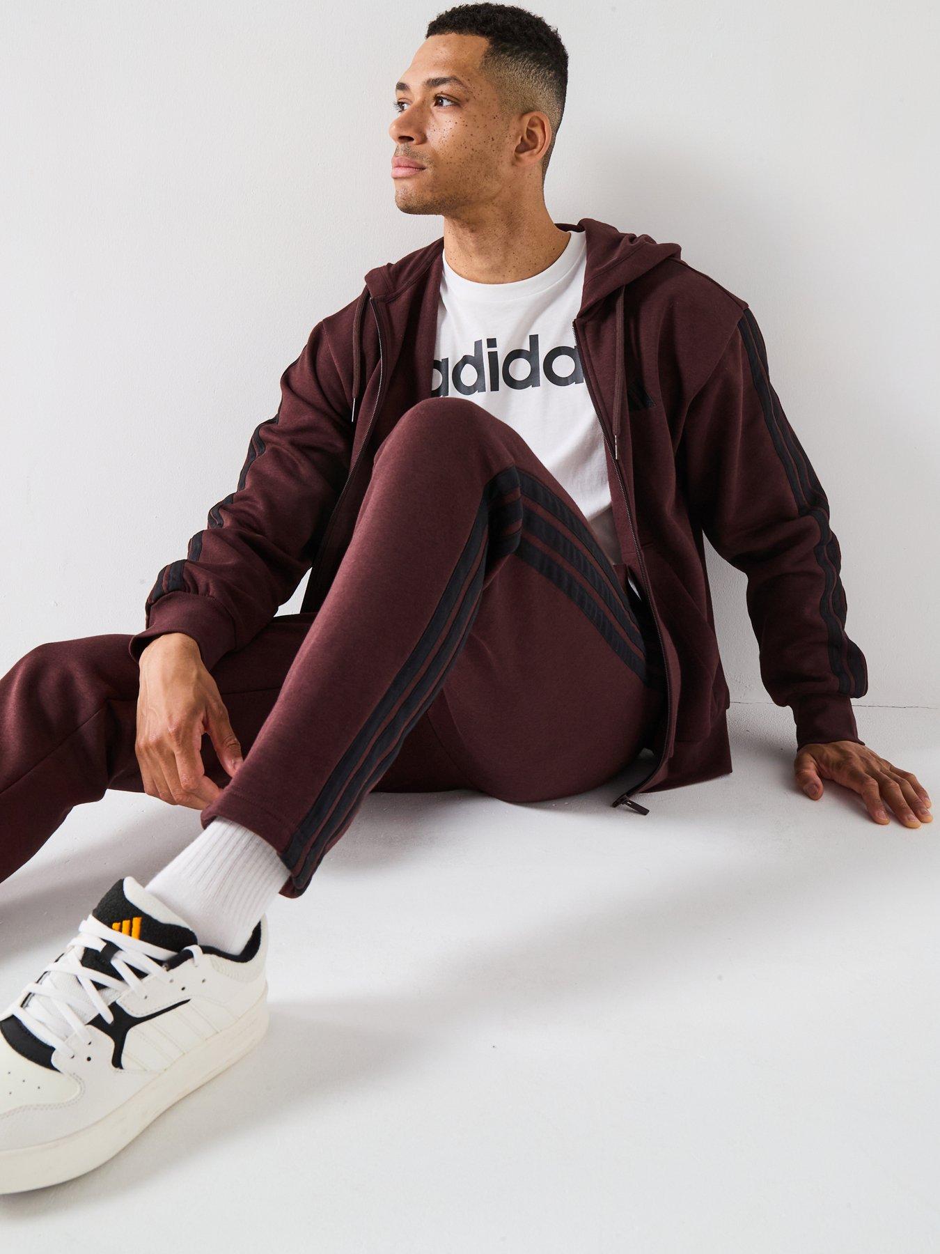  image of adidas-sportswear-mens-essentials-3-stripes-fleece-joggers-brown