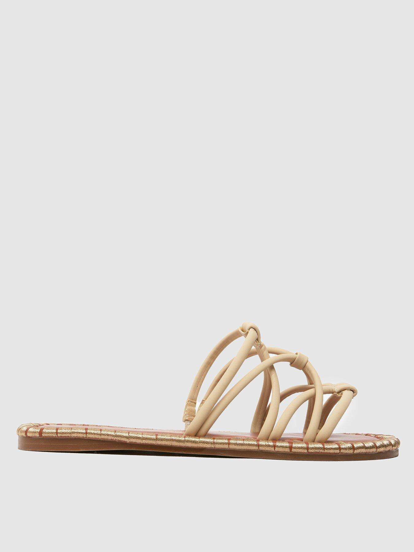 schuh-tevin-feature-rand-flat-sandal-ecru