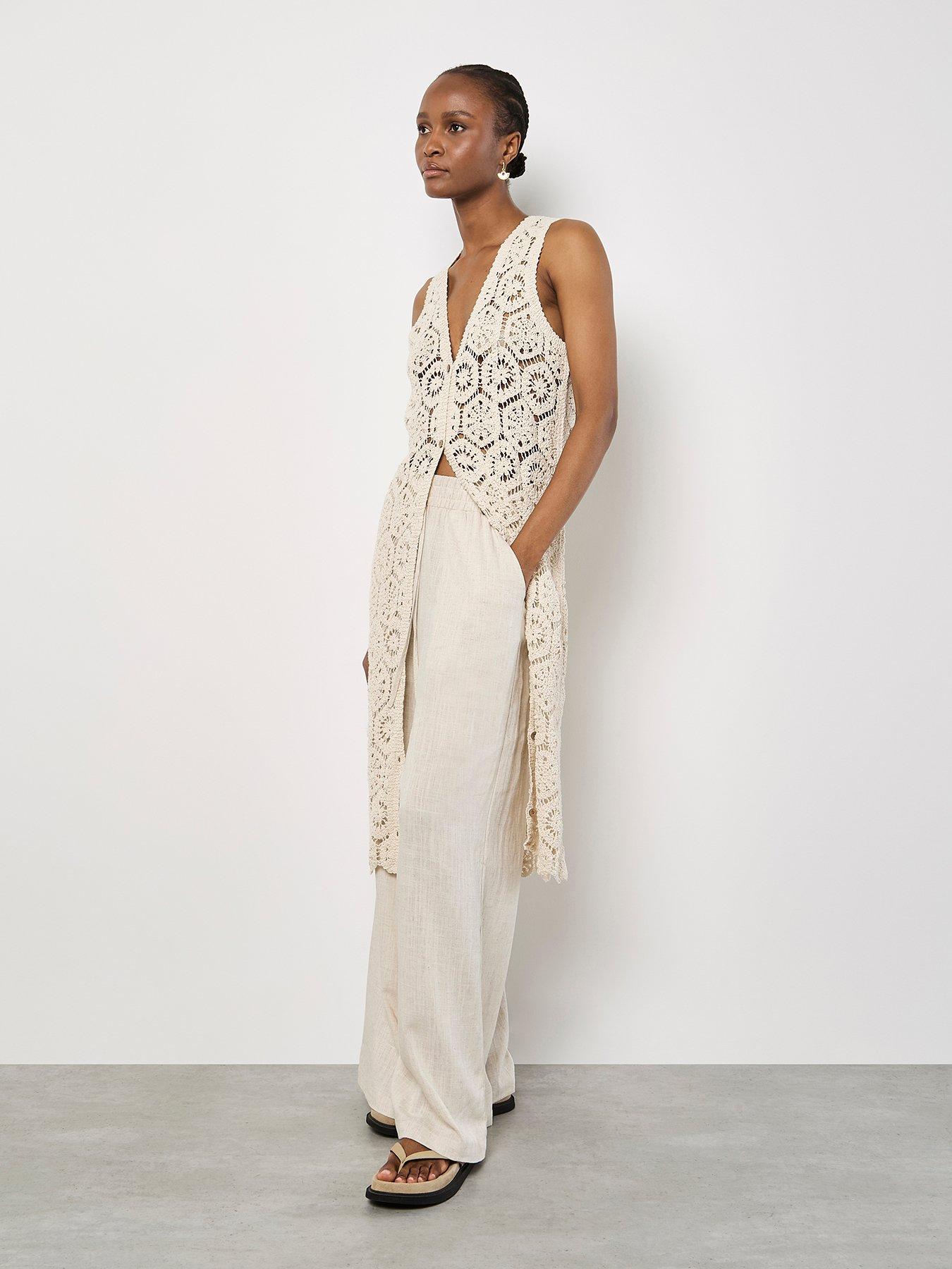  image of apricot-crochet-circles-sless-cardigan