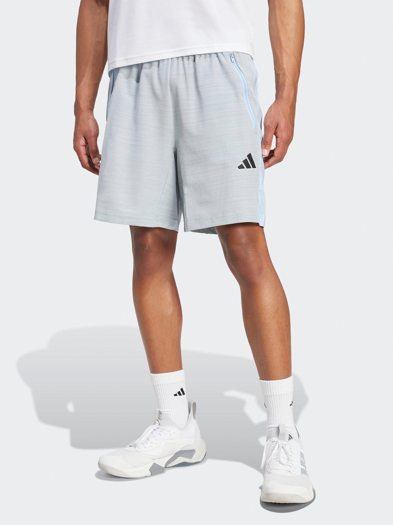 front image of adidas-mens-training-essentials-woven-melange-7inch-shorts-blue