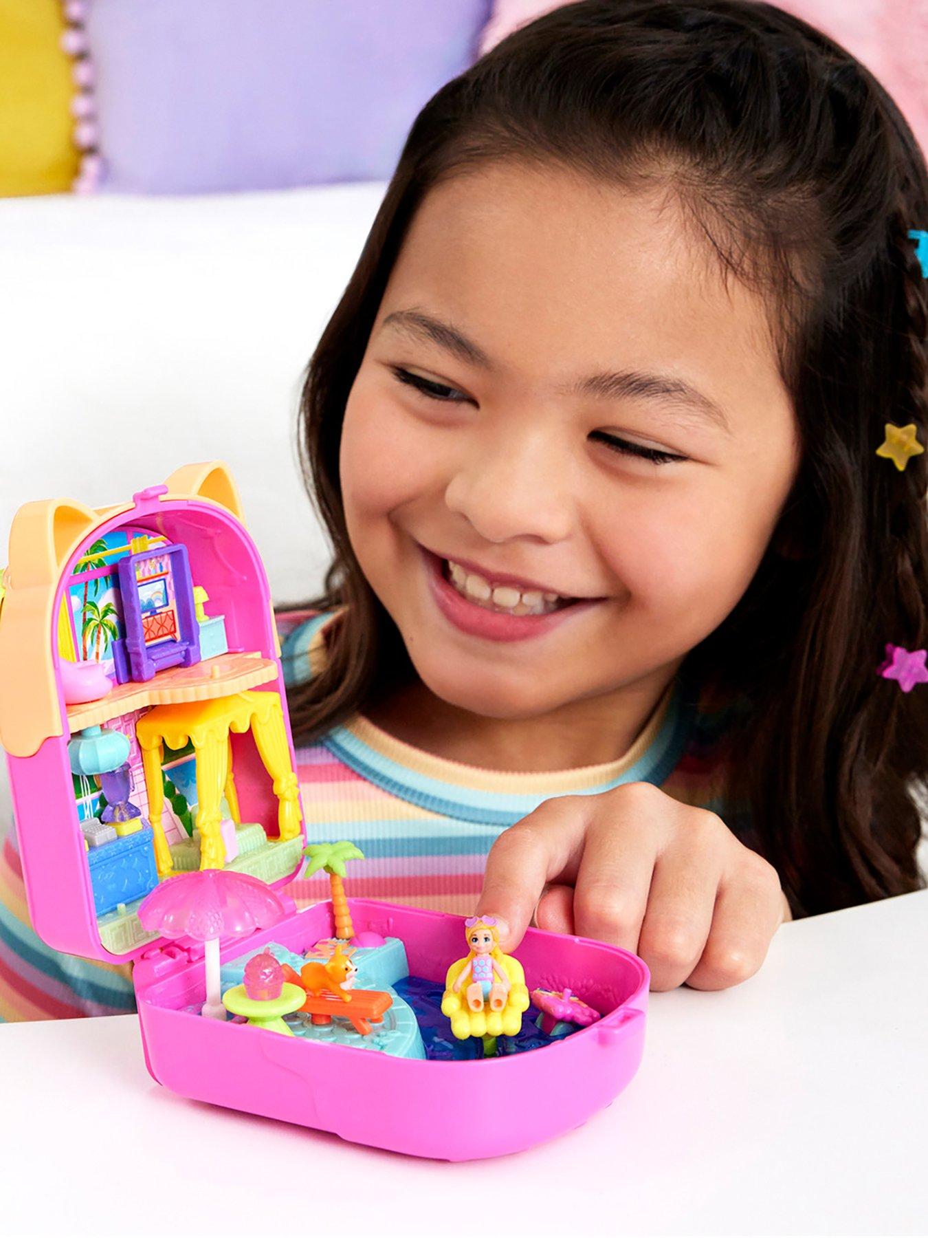 stillFront image of polly-pocket-kitty-popsicle-resort-compact-playset-with-1-micro-doll-and-pet-puppy-travel-toy-with-themed-accessories