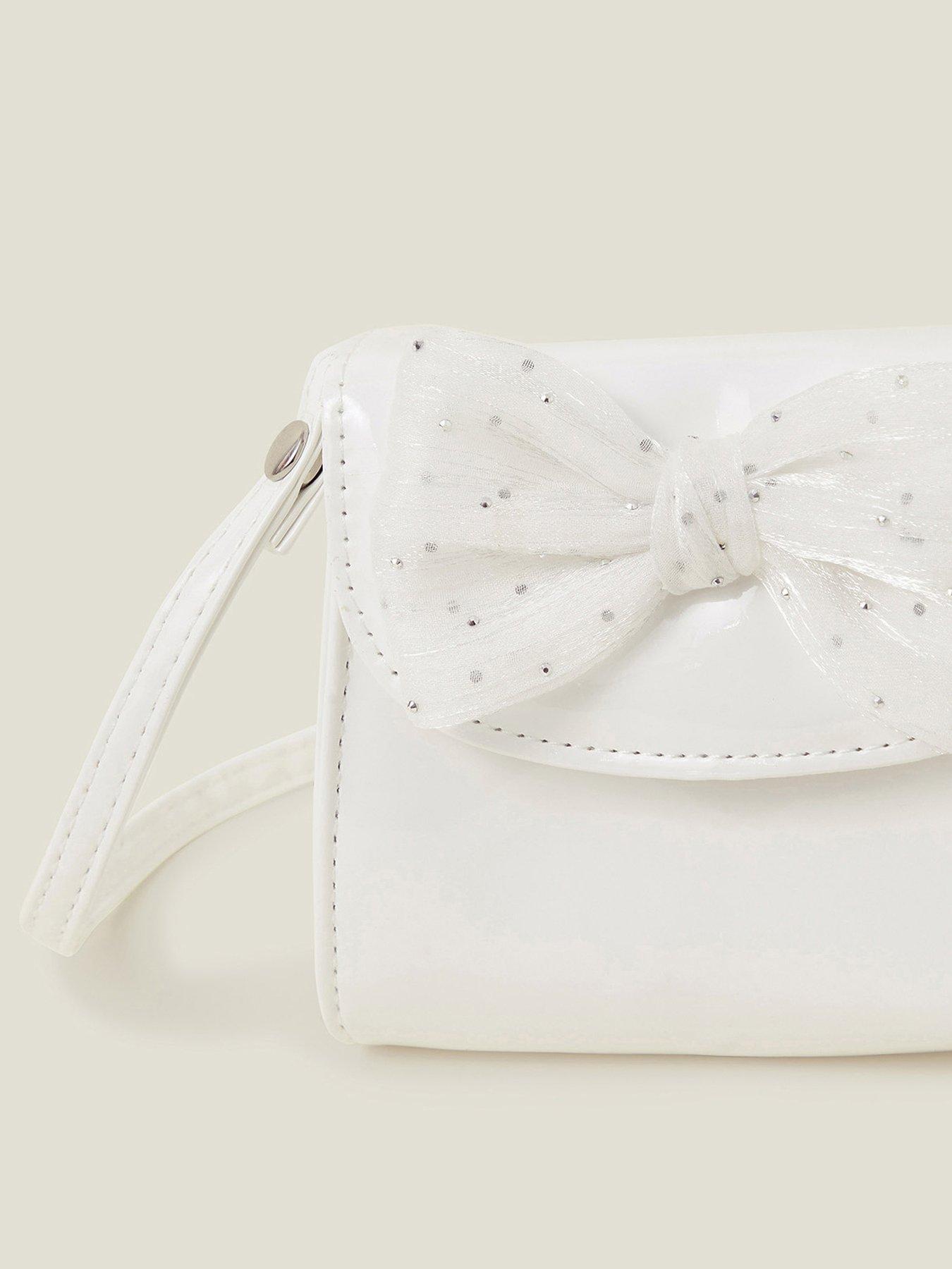  image of accessorize-girls-patent-bow-bag-light-cream