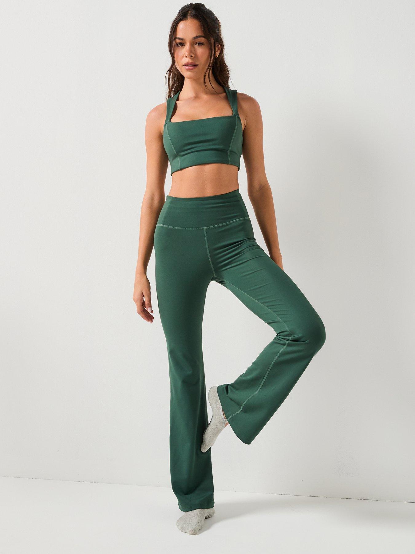  image of girlfriend-collective-womens-training-natalie-seamed-bra-open-back-green