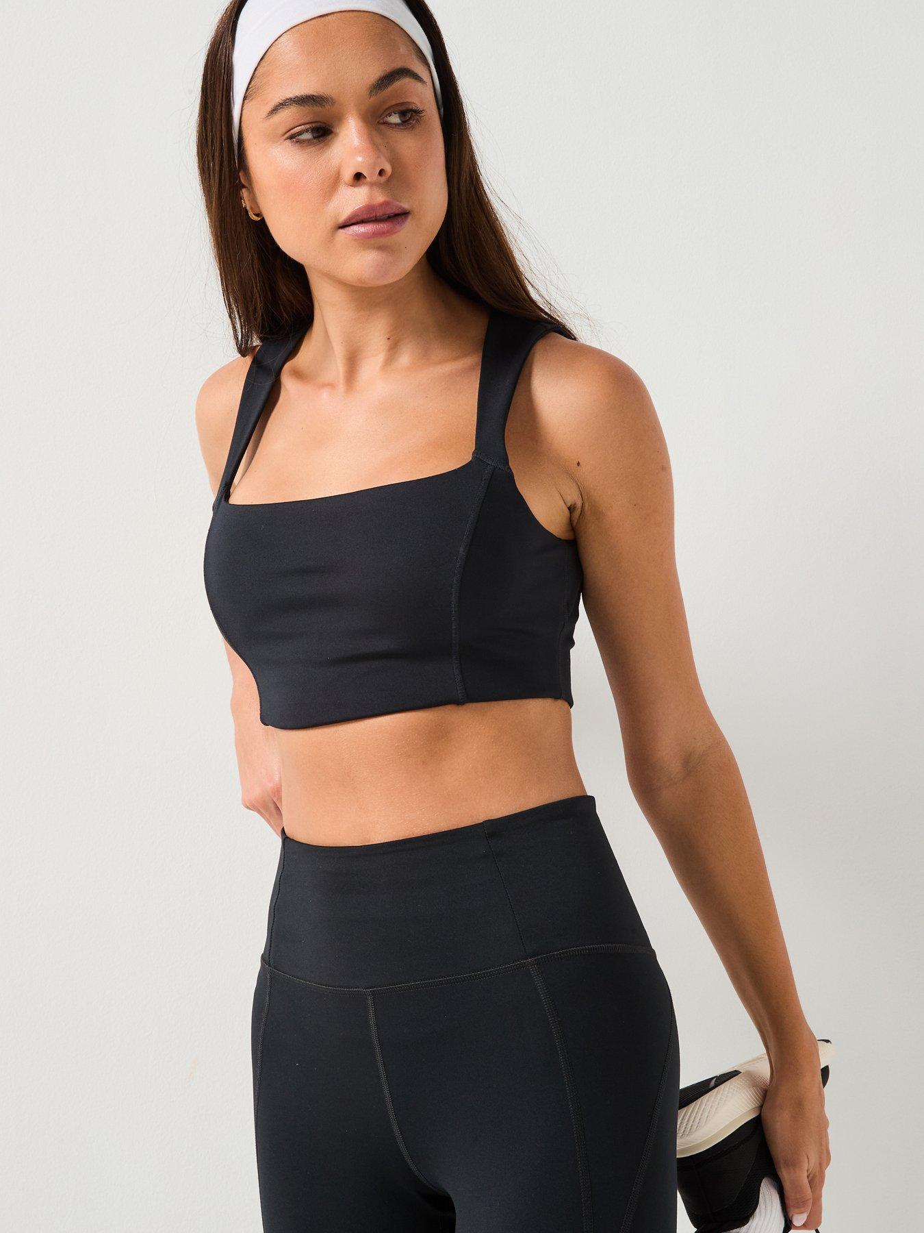  image of girlfriend-collective-womens-training-natalie-seamed-bra-open-back-black