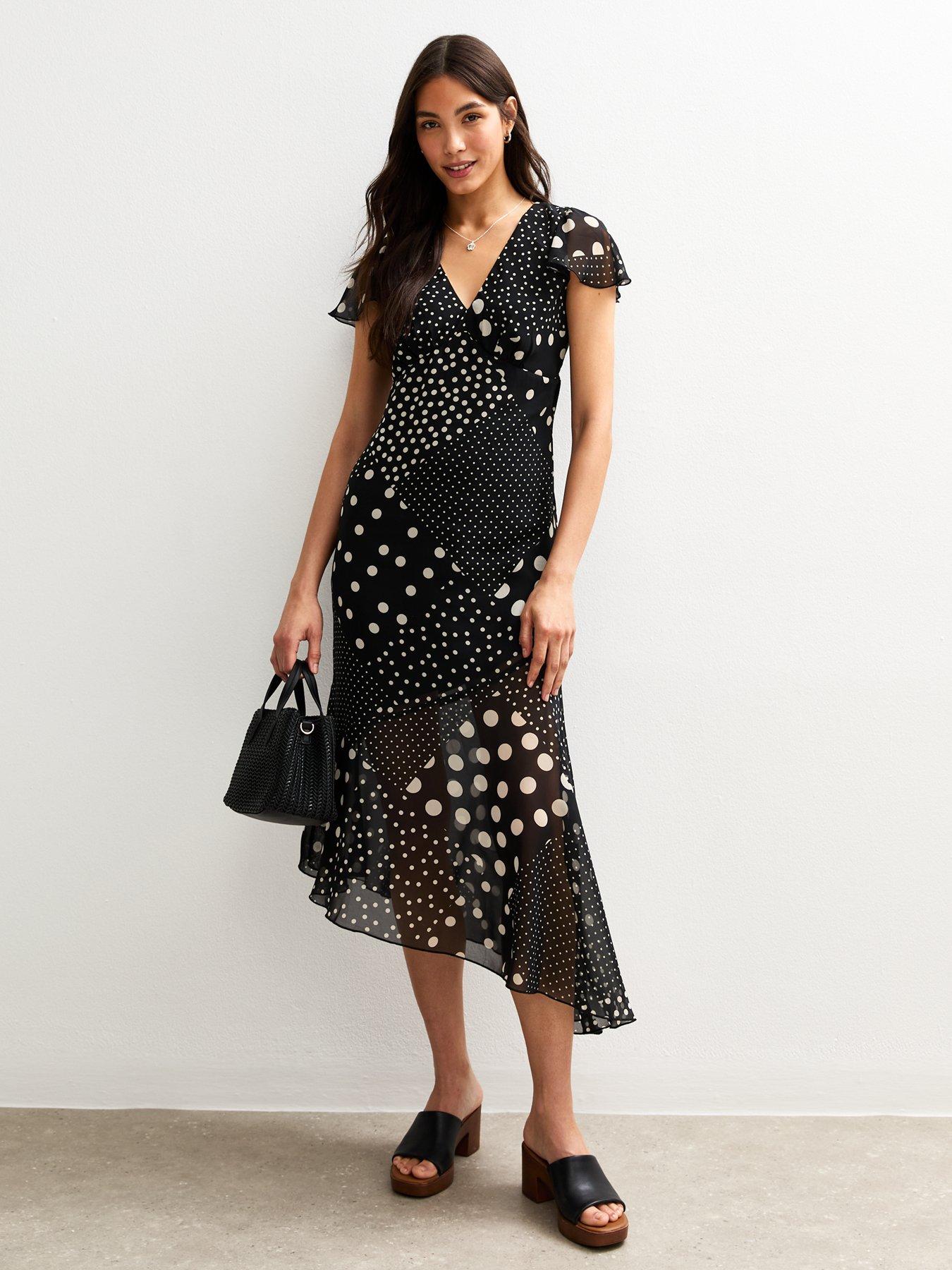 Image 1 of 4 of New Look Black Spot Print V-neck Midi Dress