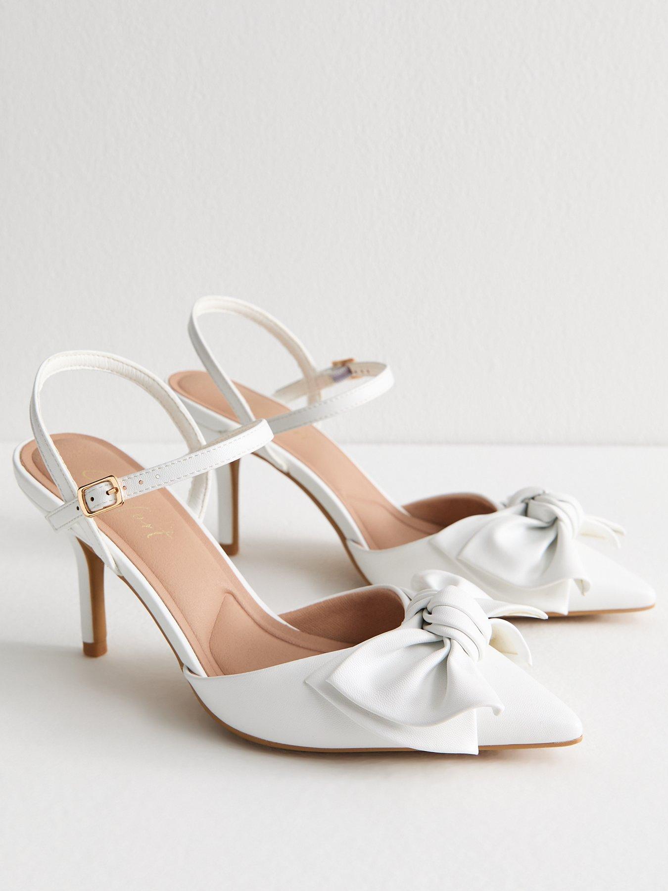  image of new-look-white-faux-leather-bow-applique-open-court-shoes