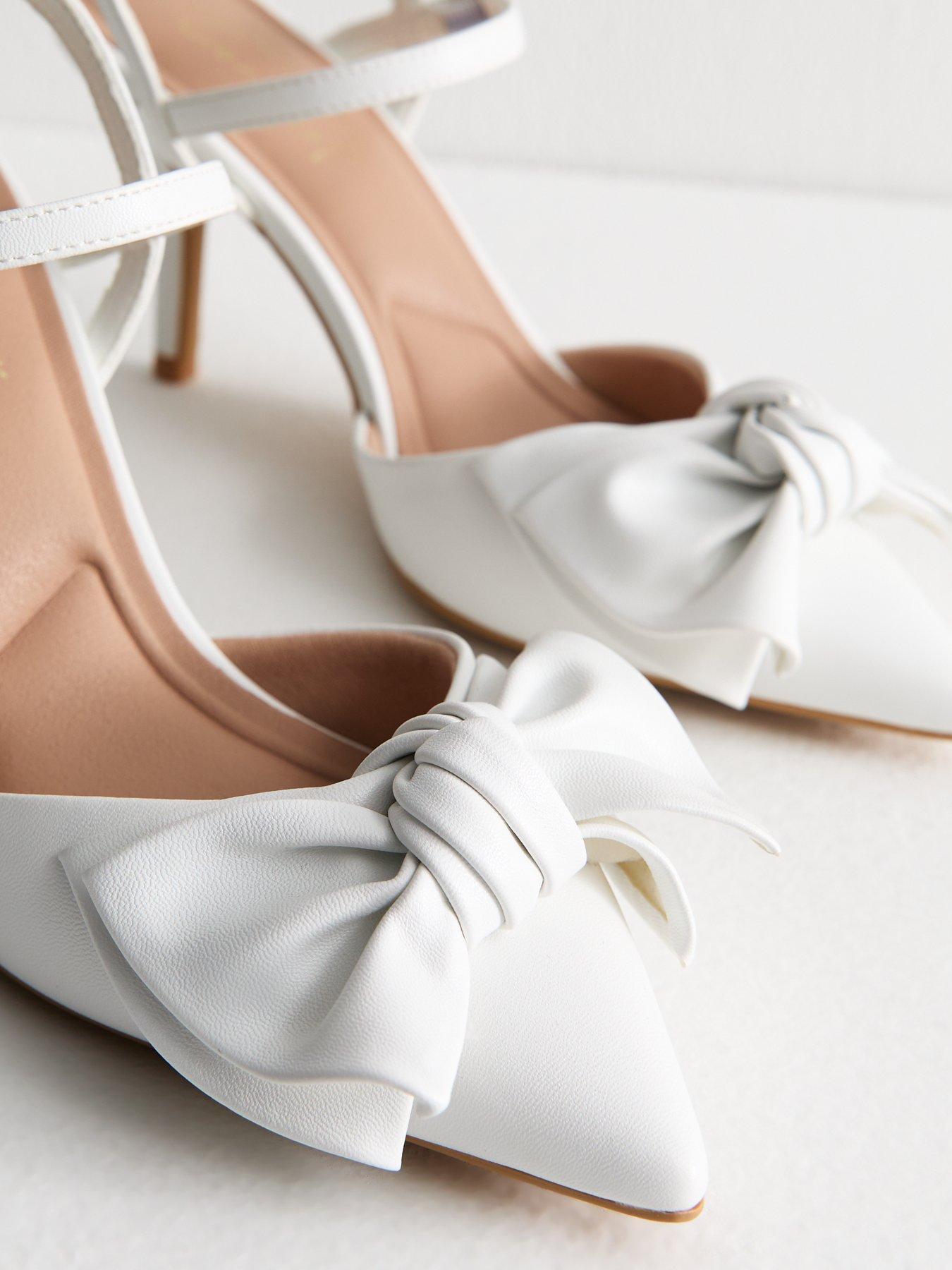  image of new-look-white-faux-leather-bow-applique-open-court-shoes