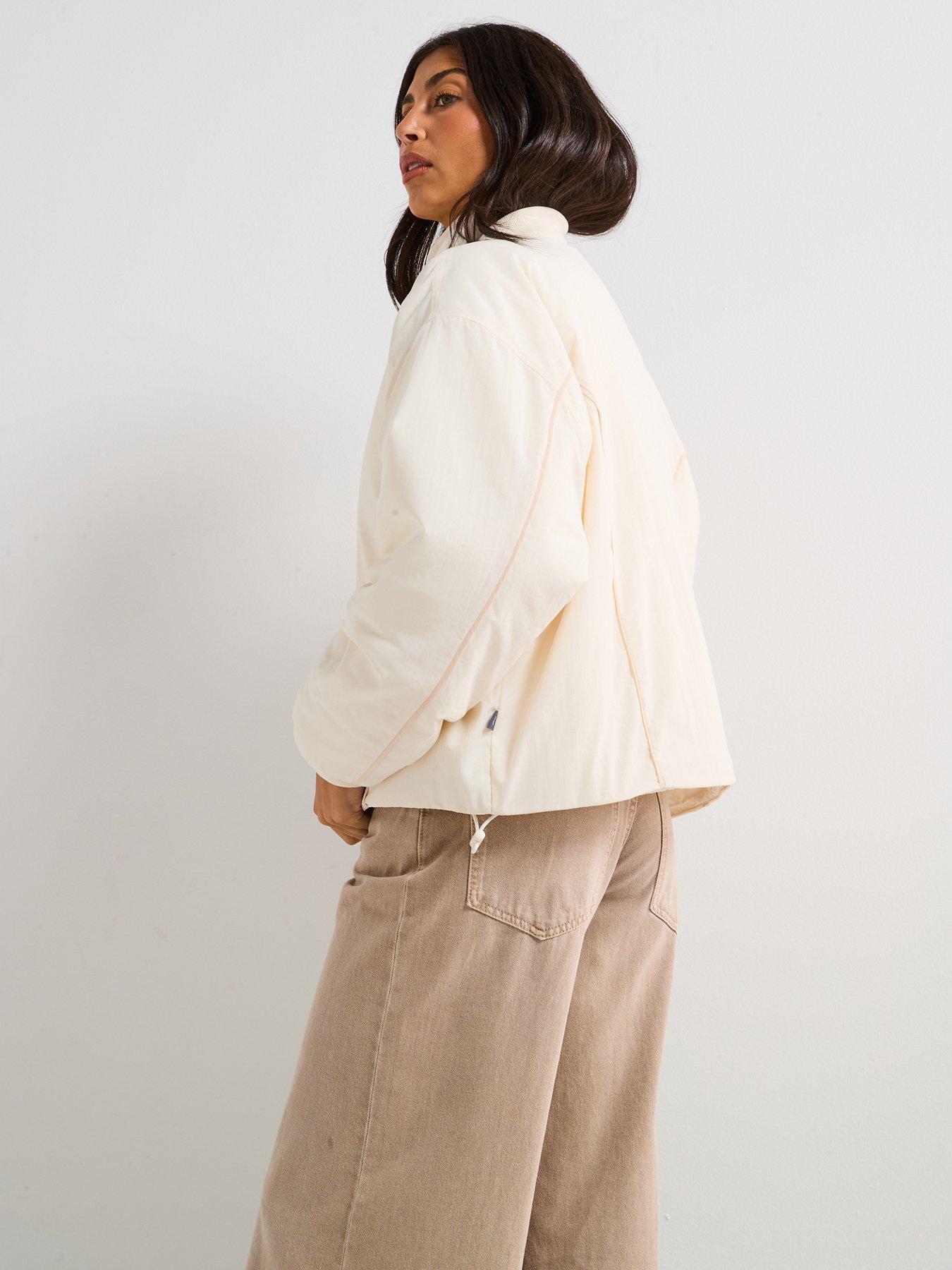  image of new-balance-womens-linear-heritage-woven-bomber-jacket-beige