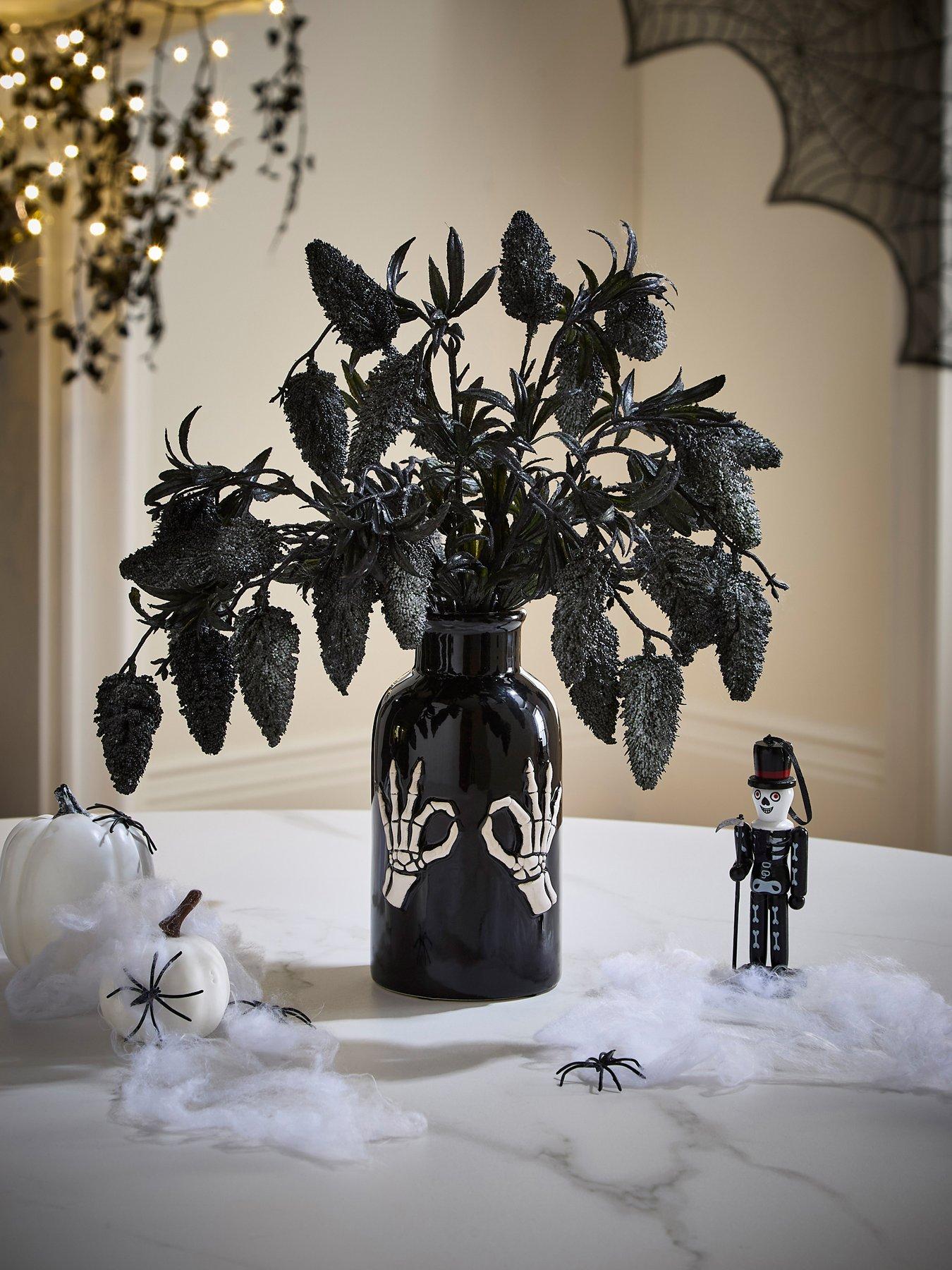 Hocus Pocus Fruit Foliage Display In A Skeleton Hand Halloween Vase
