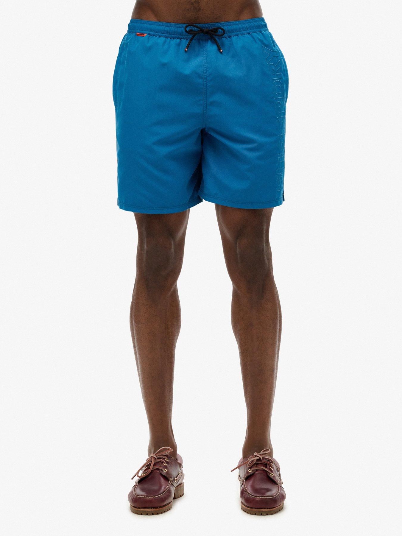 front image of superdry-premium-embroidered-17-inch-swim-shorts-blue
