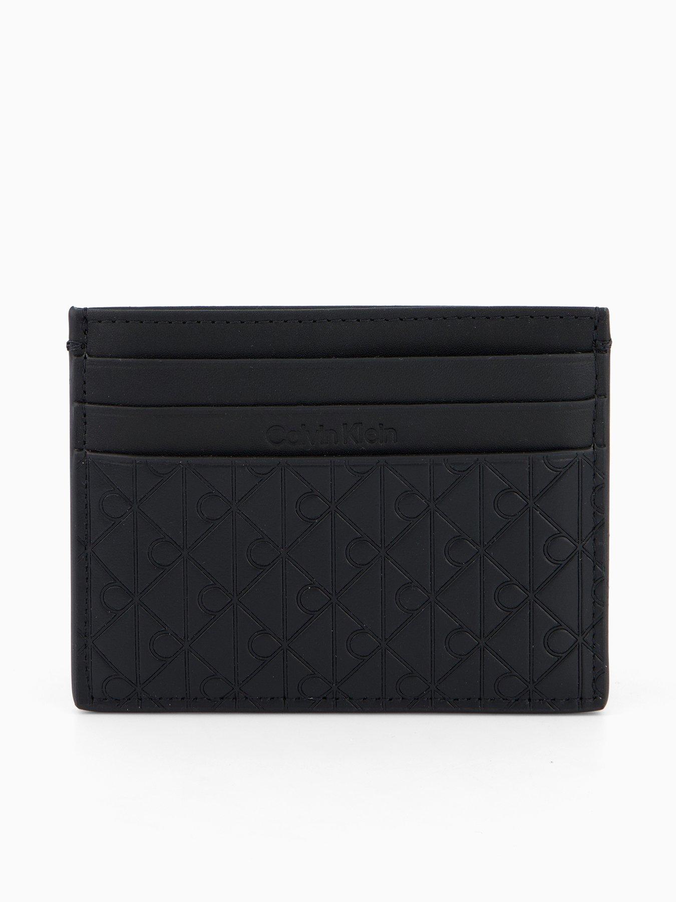 front image of calvin-klein-emblem-emboss-card-case-wallets-black