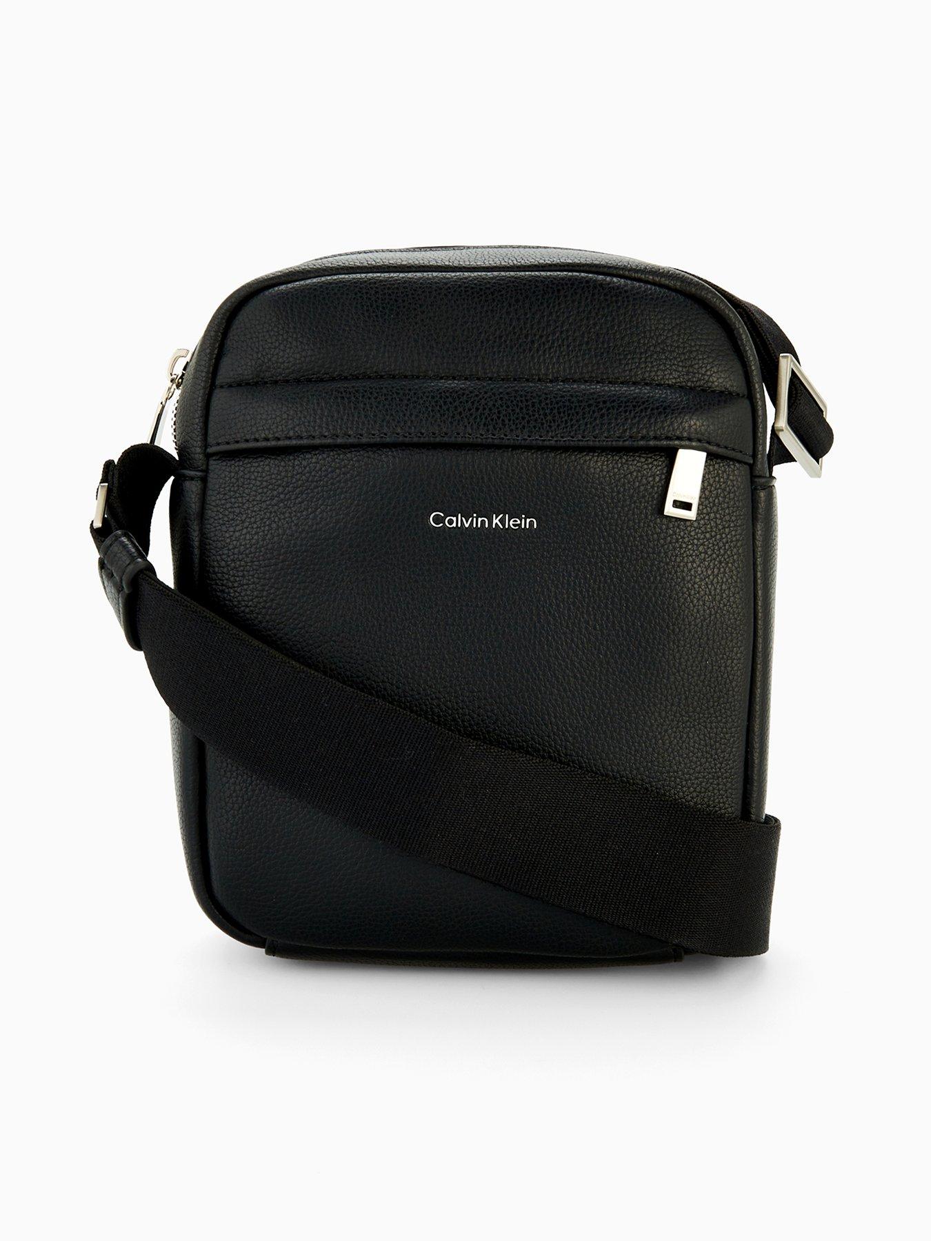 Image 1 of 4 of Calvin Klein Calvin Klein Raised Reporter Leather Cross Body Bag - Black