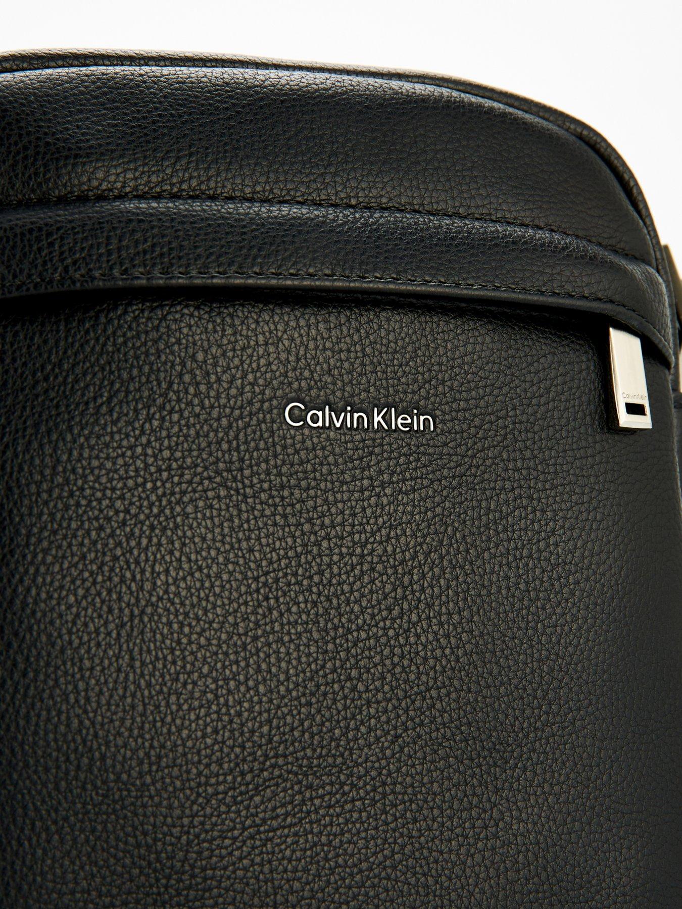 Image 4 of 4 of Calvin Klein Calvin Klein Raised Reporter Leather Cross Body Bag - Black
