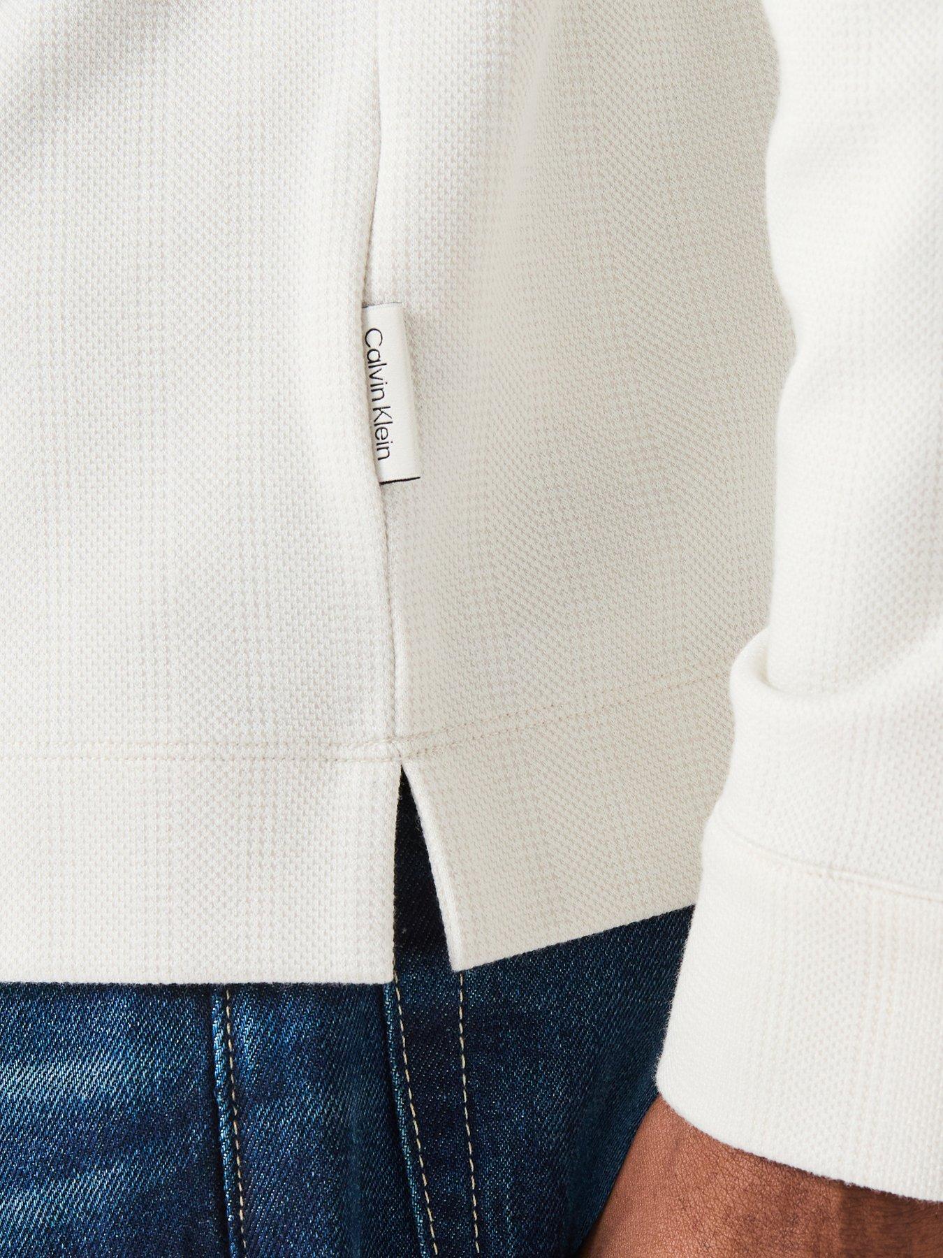  image of calvin-klein-long-sleeve-jacquard-wool-knitted-polo-shirt-cream