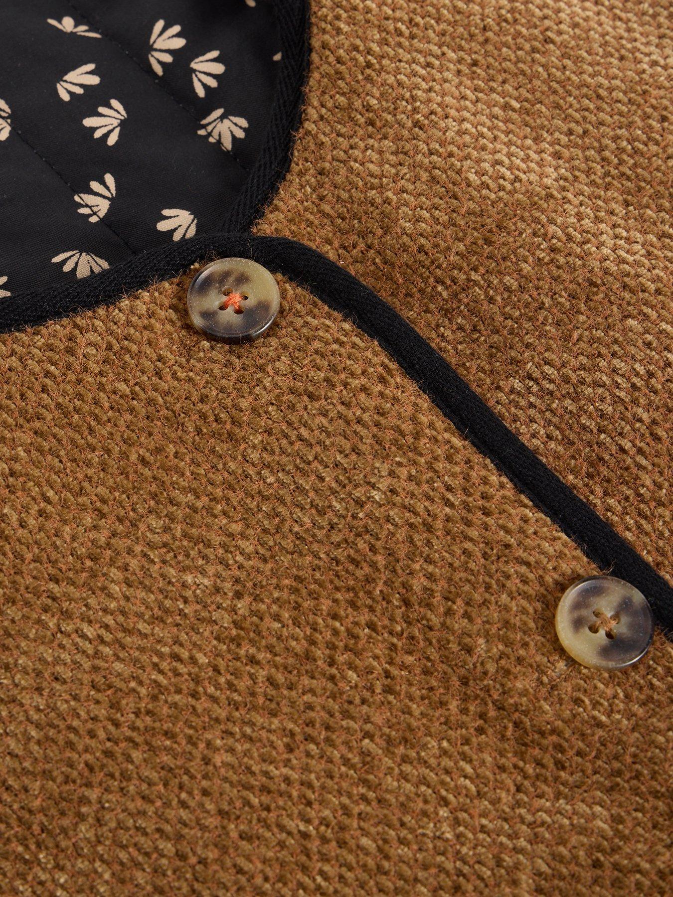  image of white-stuff-emma-reversible-gilet-black