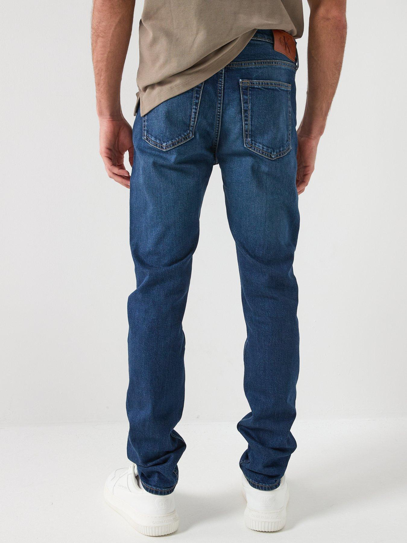  image of calvin-klein-jeans-slim-taper-oil-slick-jeans-dark-blue