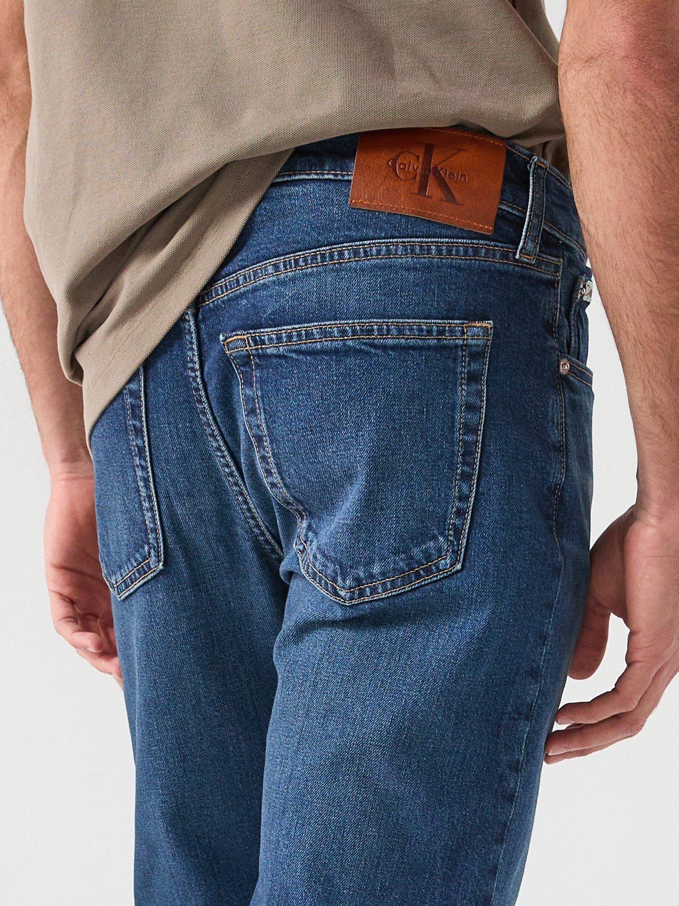  image of calvin-klein-jeans-slim-taper-oil-slick-jeans-dark-blue