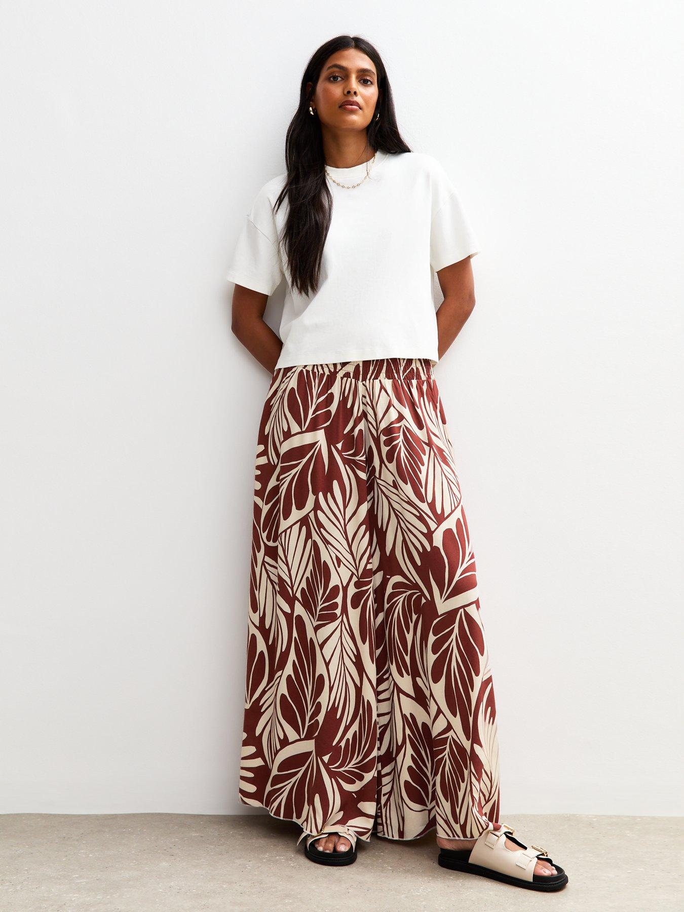 Image 1 of 4 of New Look Brown Leaf Print Palazzo Trousers