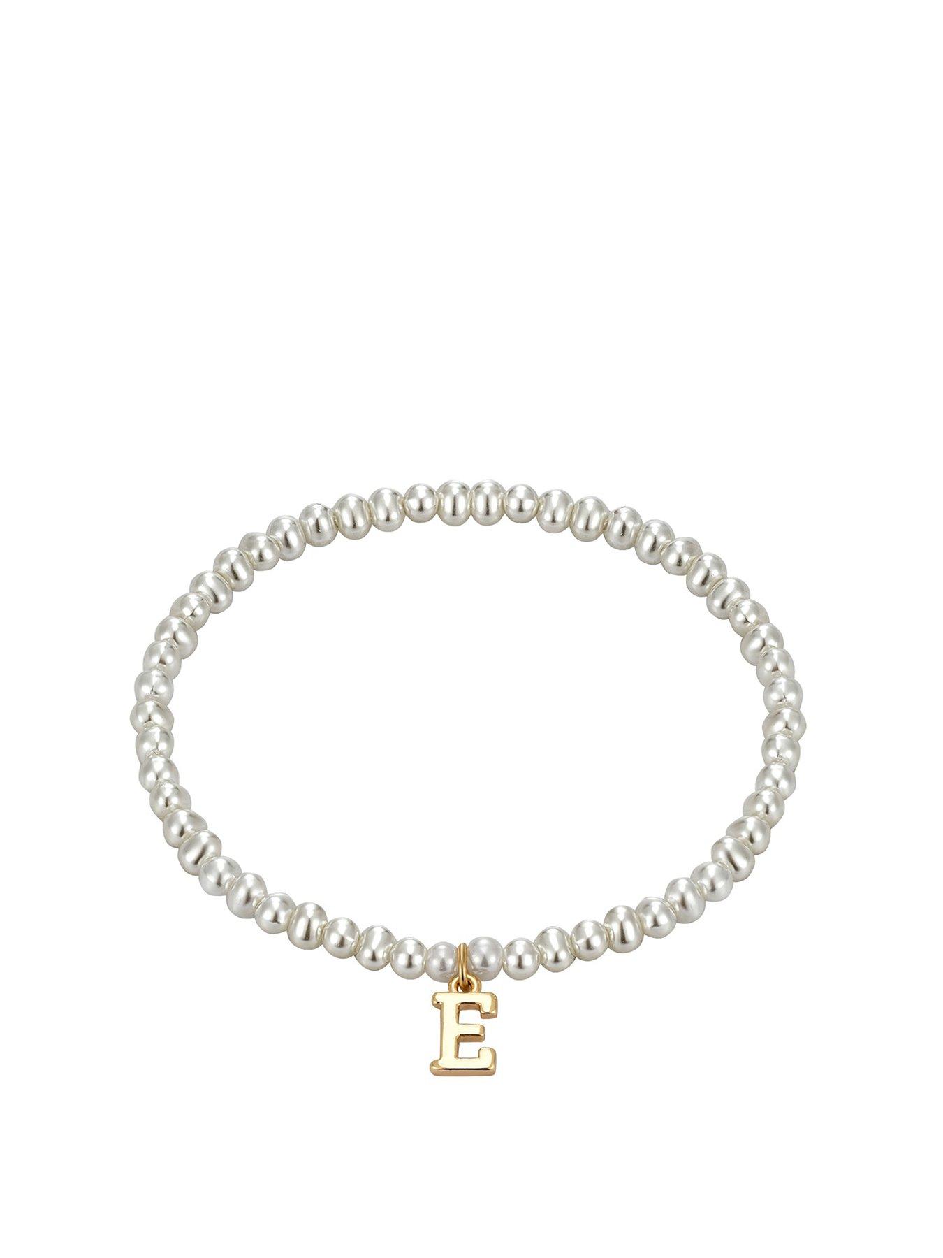 Image 1 of 4 of The Love Collection Pearl Stretch Bracelet with Gold Letter Charm