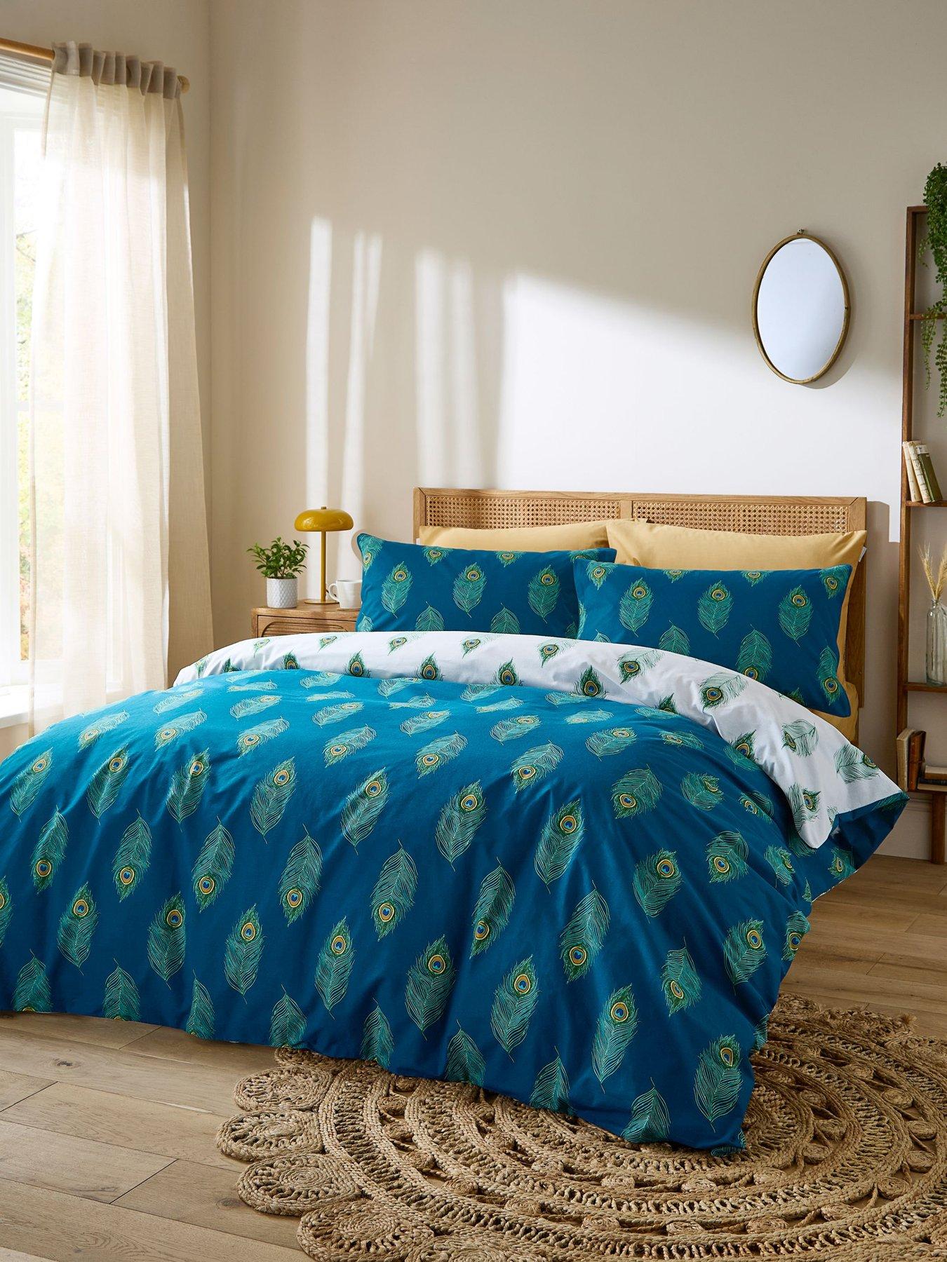 front image of their-nibs-peacock-feather-100-cotton-reversible-duvet-set-teal-green