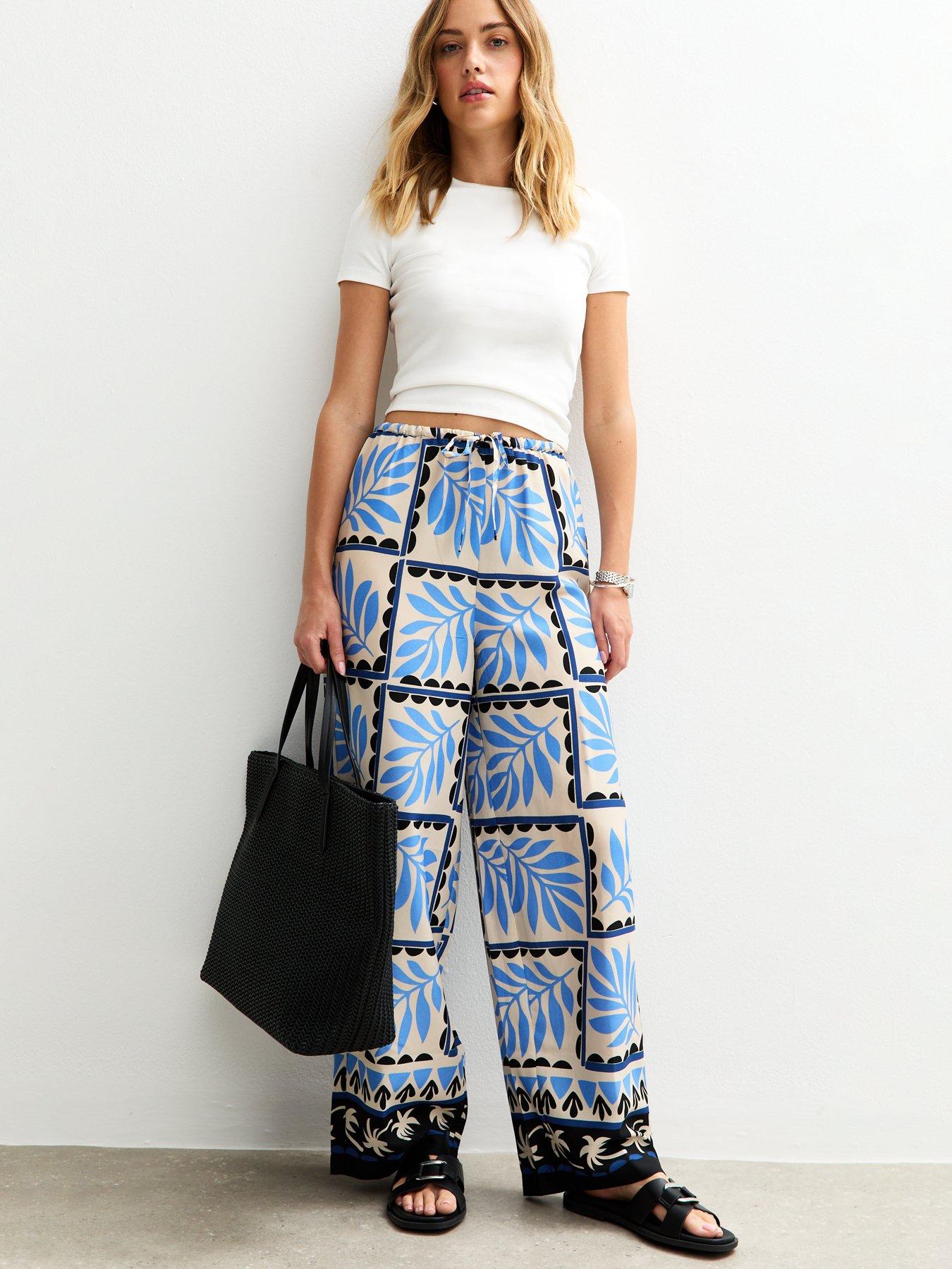 Image 1 of 4 of New Look Blue Crepe Palm Print Wide Leg Trousers
