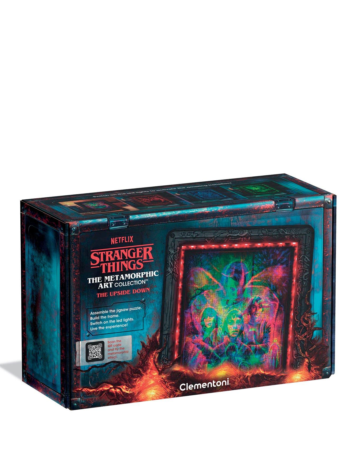 front image of clementoni-stranger-things-ndash-the-upside-downnbspndash-520-piece-jigsaw-puzzle-with-metamorphic-art-and-led-light-display