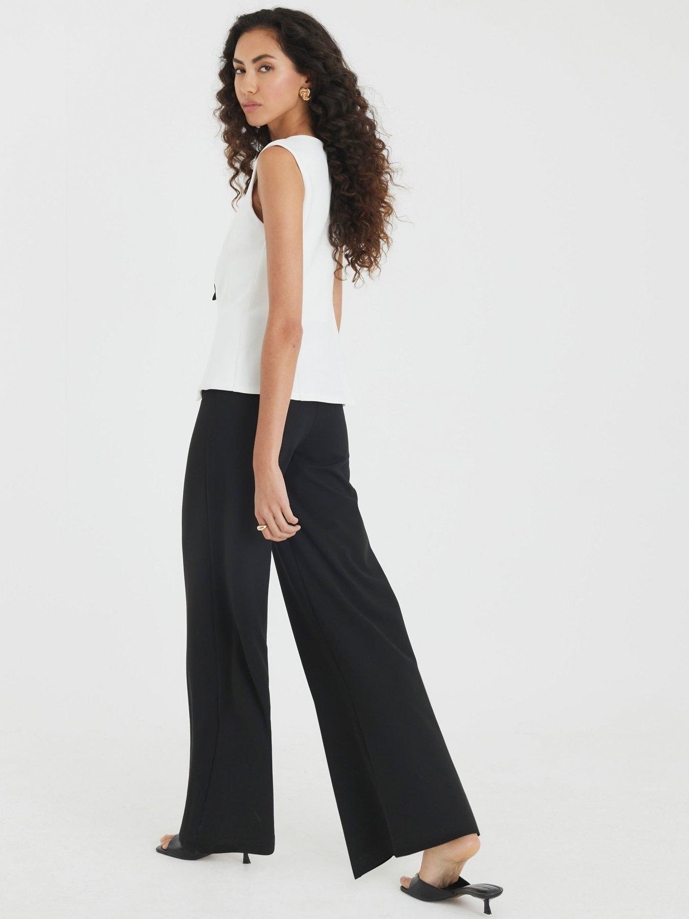 Image 2 of 3 of River Island Short Bow Hybrid Jumpsuit - Black