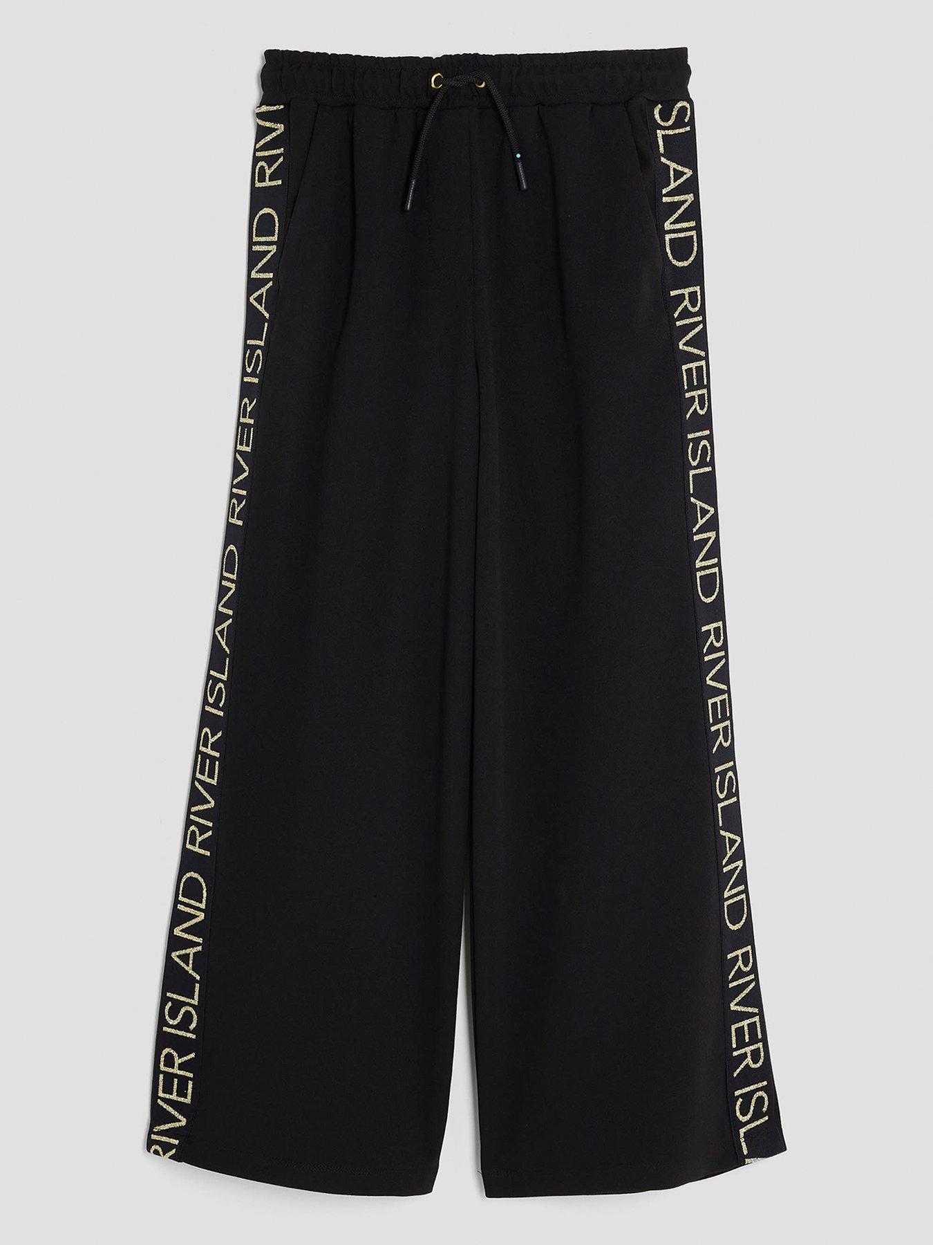 Image 1 of 4 of River Island Older Girls Side Tape Logo Wide Leg Trousers - Black