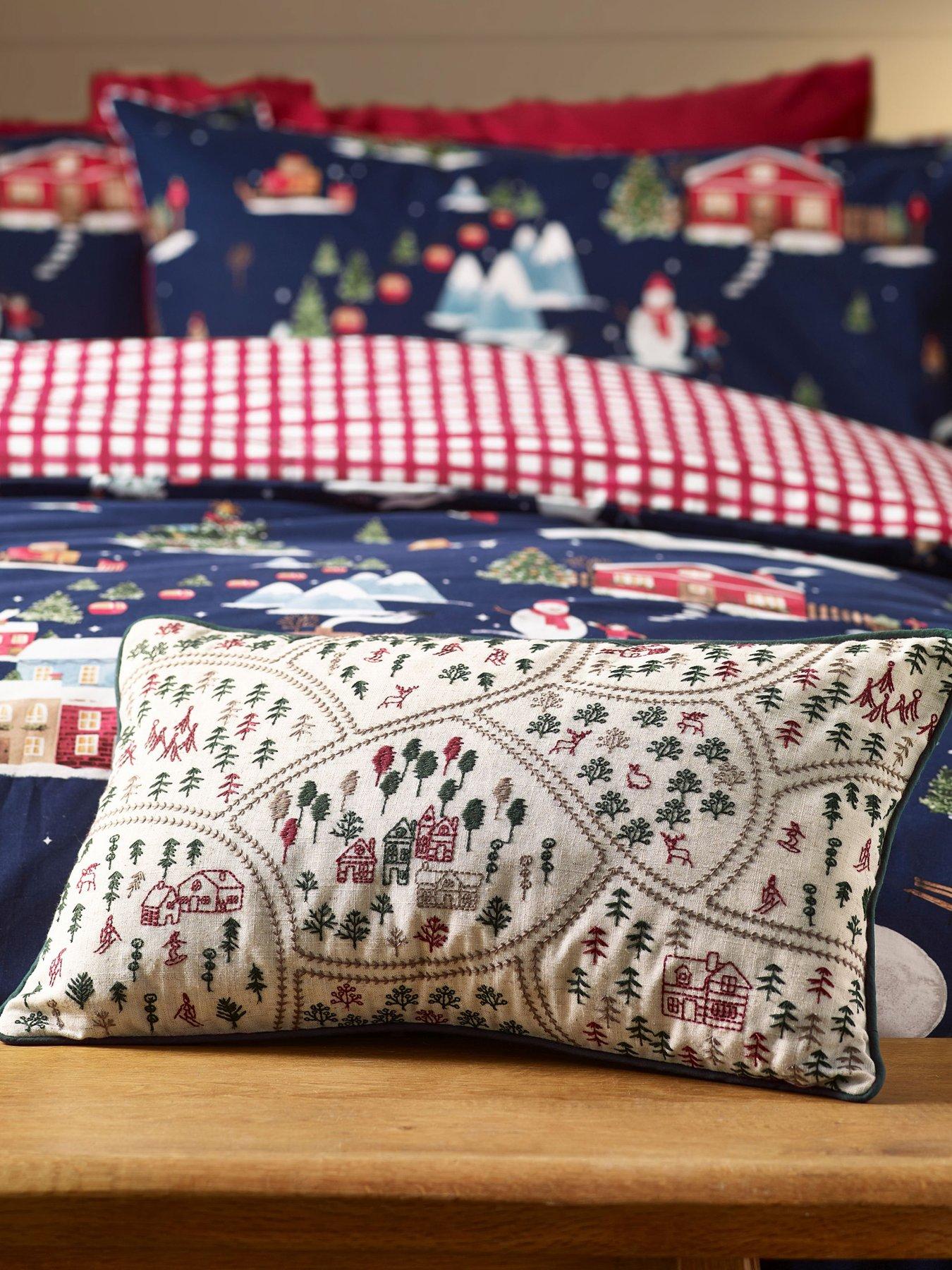 Image 1 of 3 of Catherine Lansfield Christmas Ski Village Filled Cushion- 30x50cm
