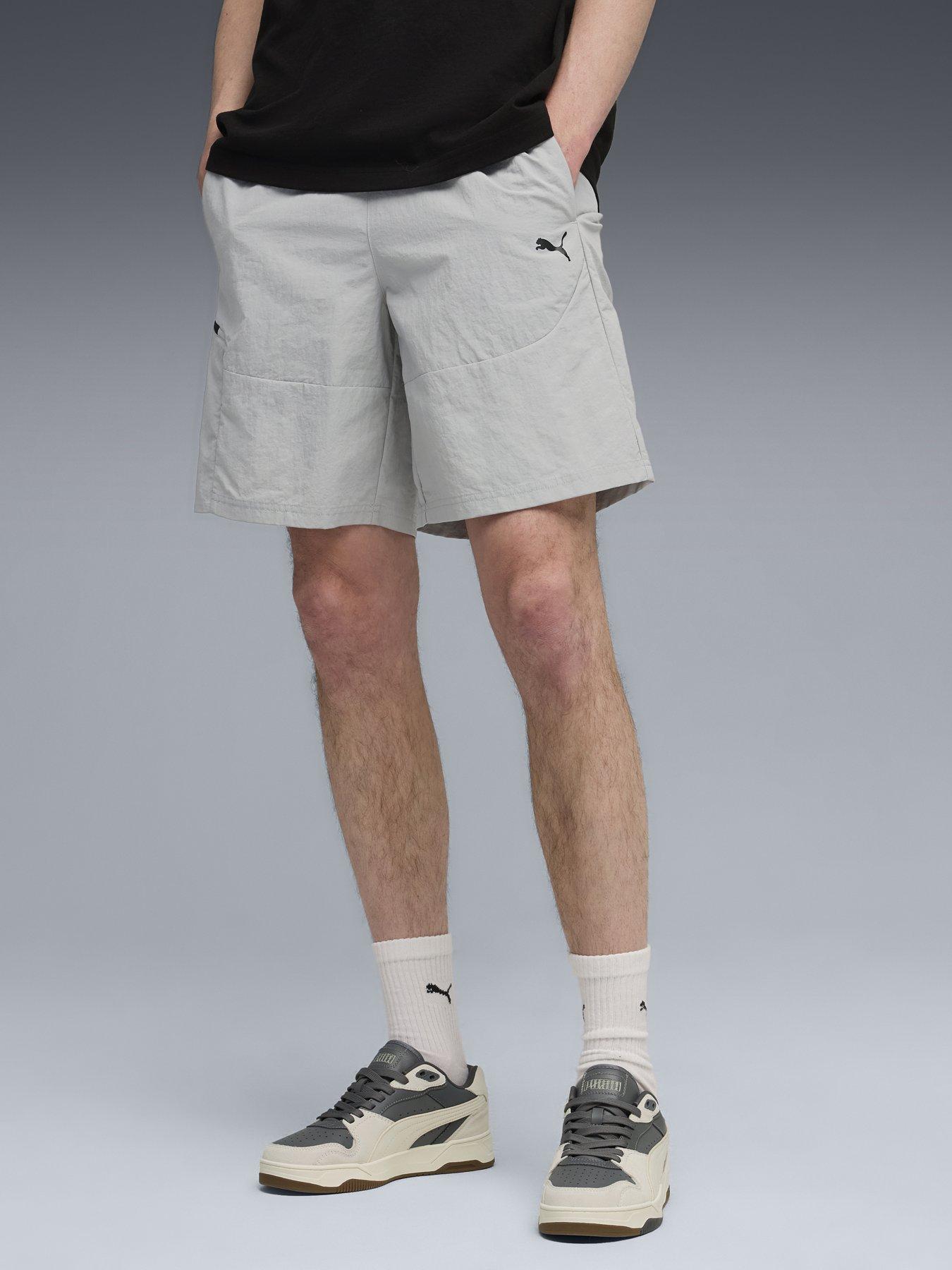 front image of puma-mens-pumatech-woven-shorts-grey