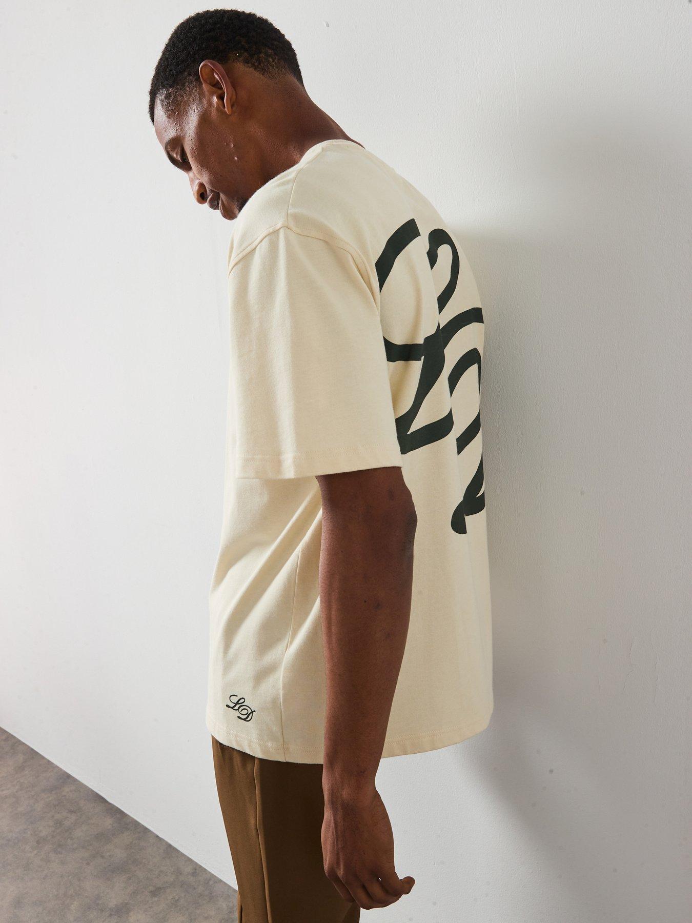  image of les-deux-danton-large-back-initial-logo-t-shirt-light-beige