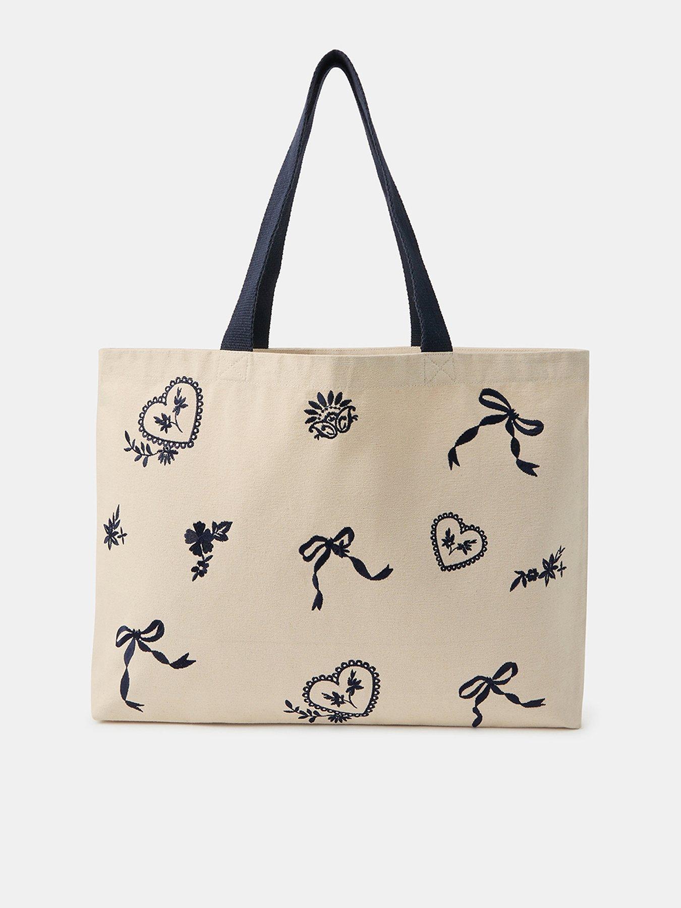 Image 1 of 5 of Accessorize Bow Embroidered Shopper Bag - Cream