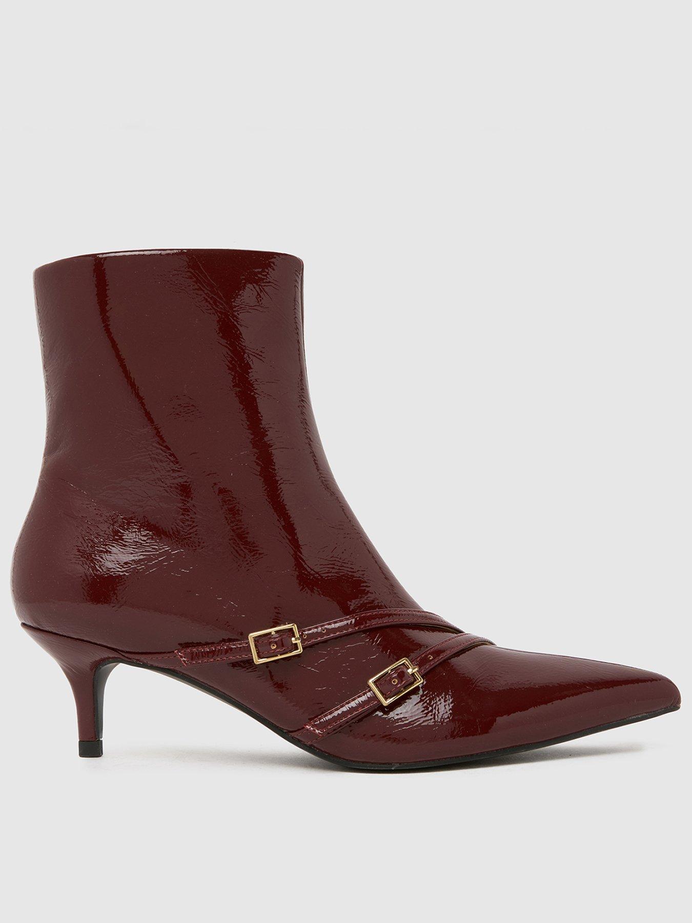 front image of schuh-beckett-buckle-kitten-boots-red