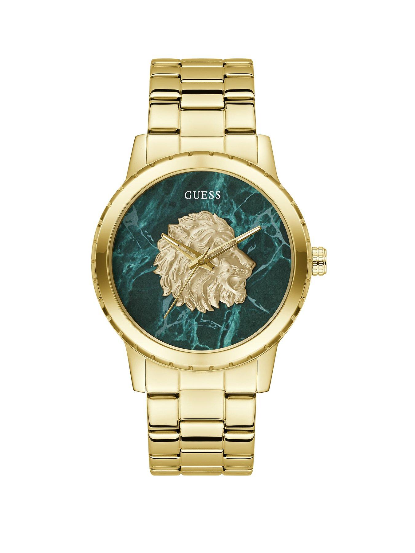 undefined GUESS gold tone green dial with lion head and gold tone bracelet