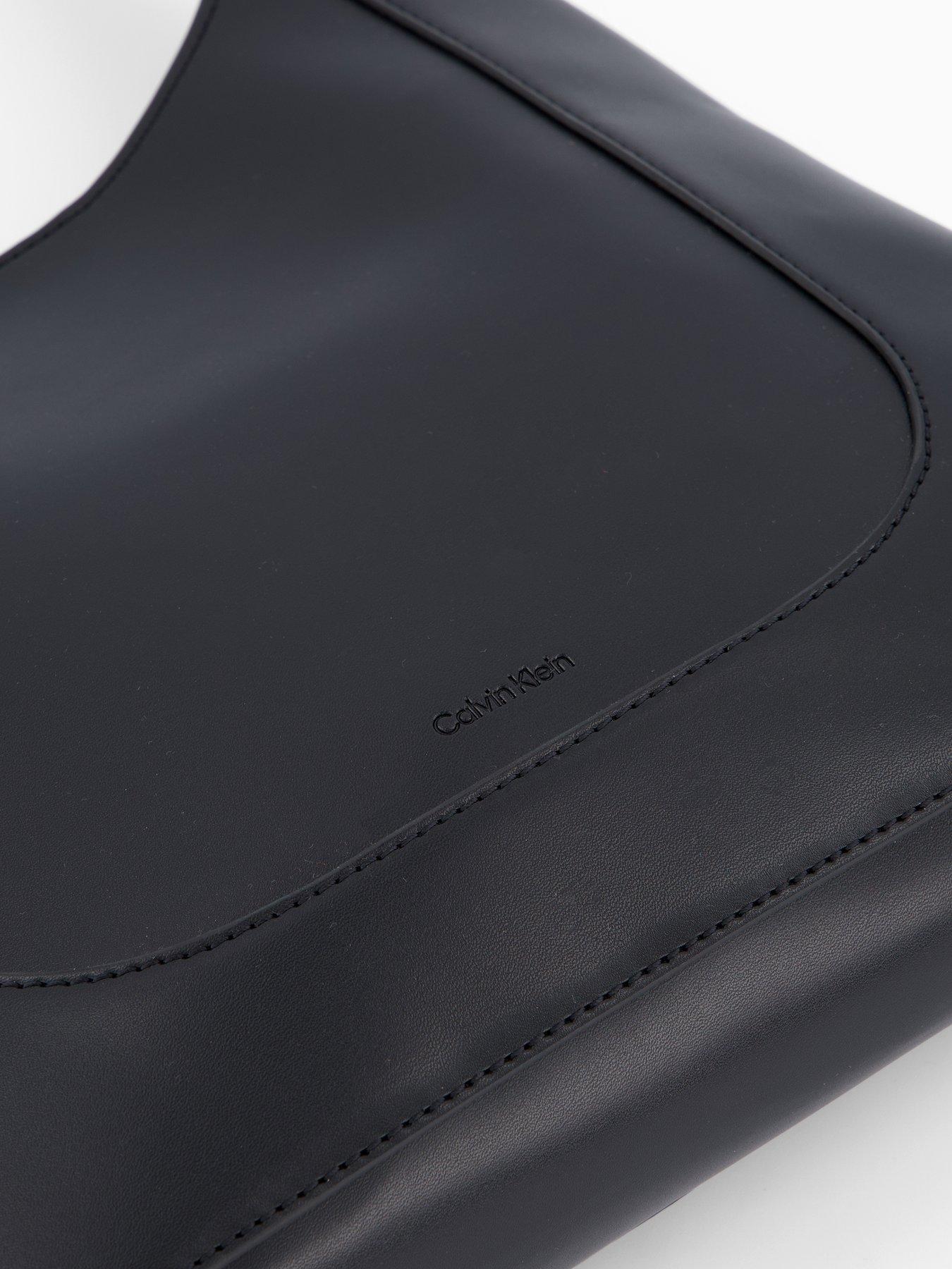 Image 4 of 5 of Calvin Klein Engraved Hardware Adjustable Strap Medium Bag - Black/Tumbled Deep Gold