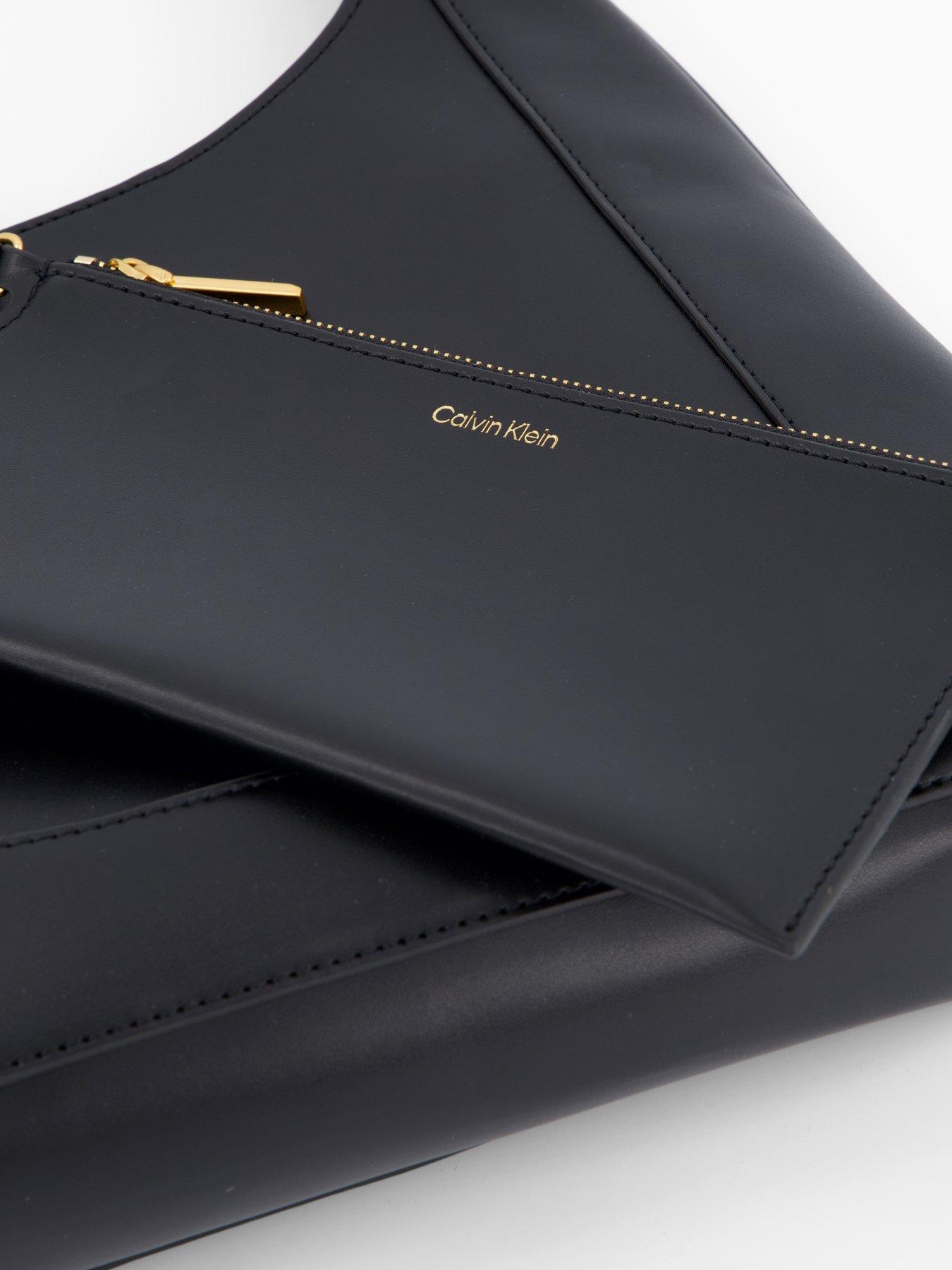 Image 5 of 5 of Calvin Klein Engraved Hardware Adjustable Strap Medium Bag - Black/Tumbled Deep Gold