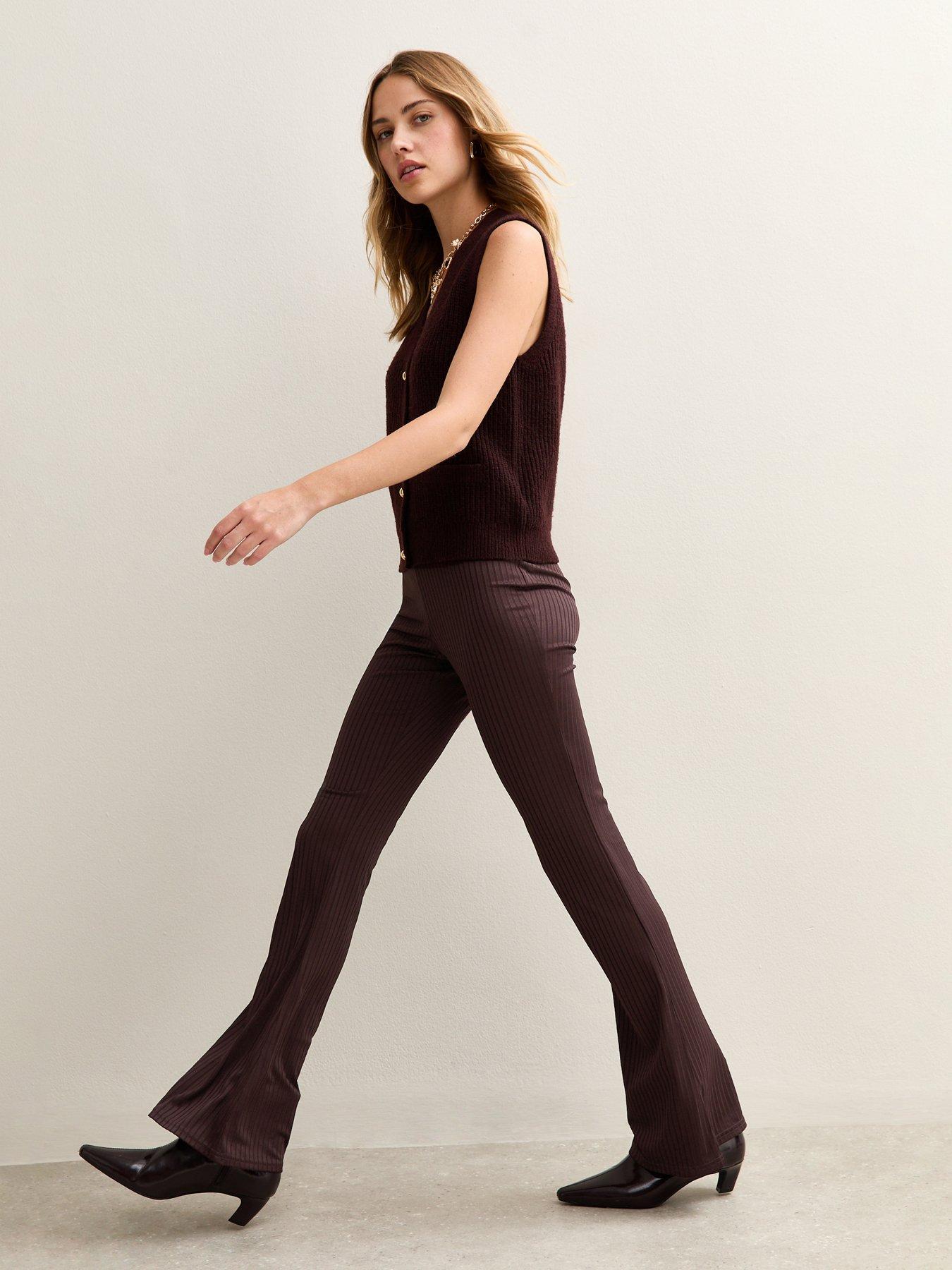  image of new-look-ribbed-jersey-flared-trousers-dark-red