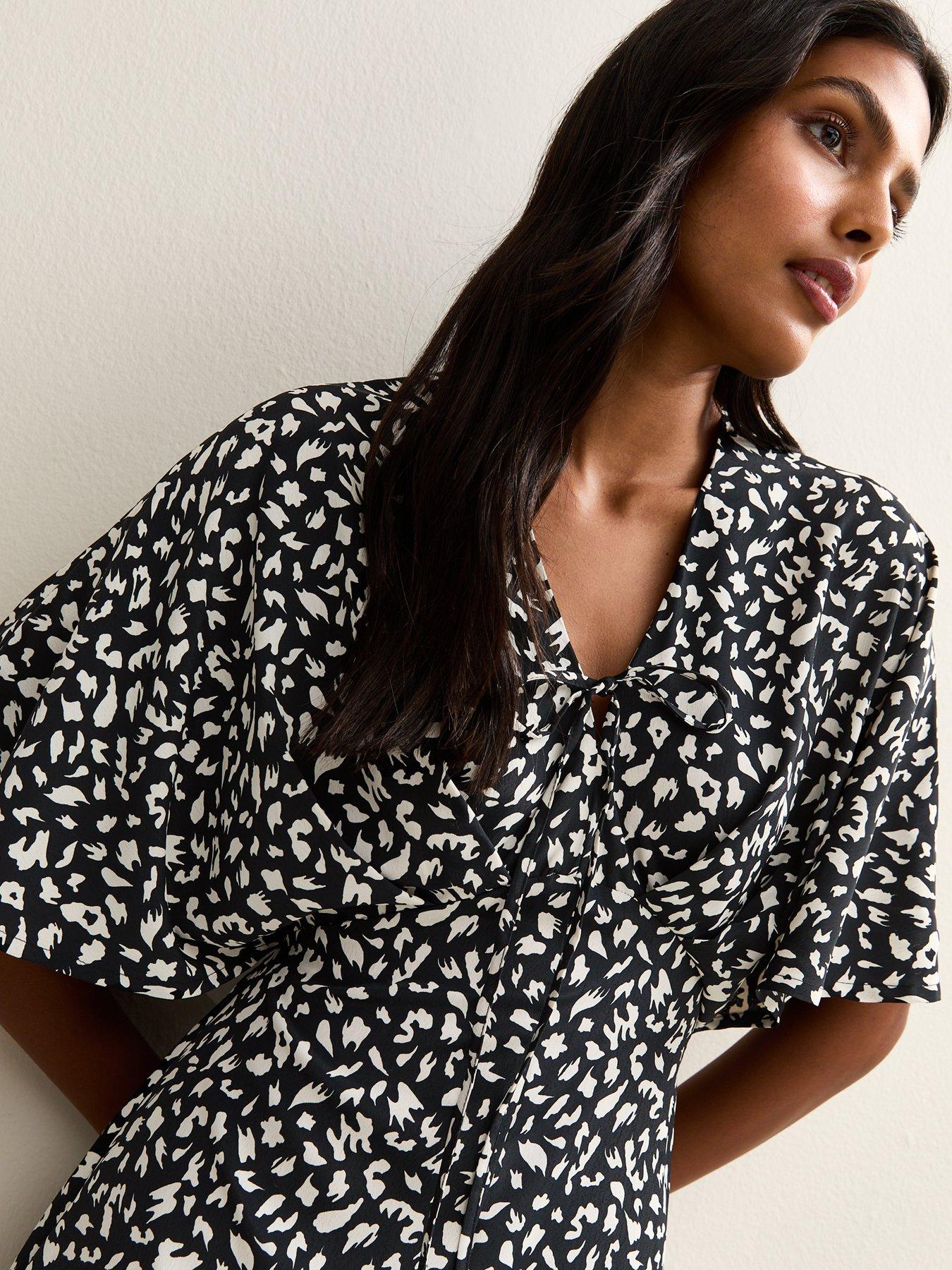 Image 4 of 5 of New Look Black Animal Print Batwing Sleeve Midi Dress