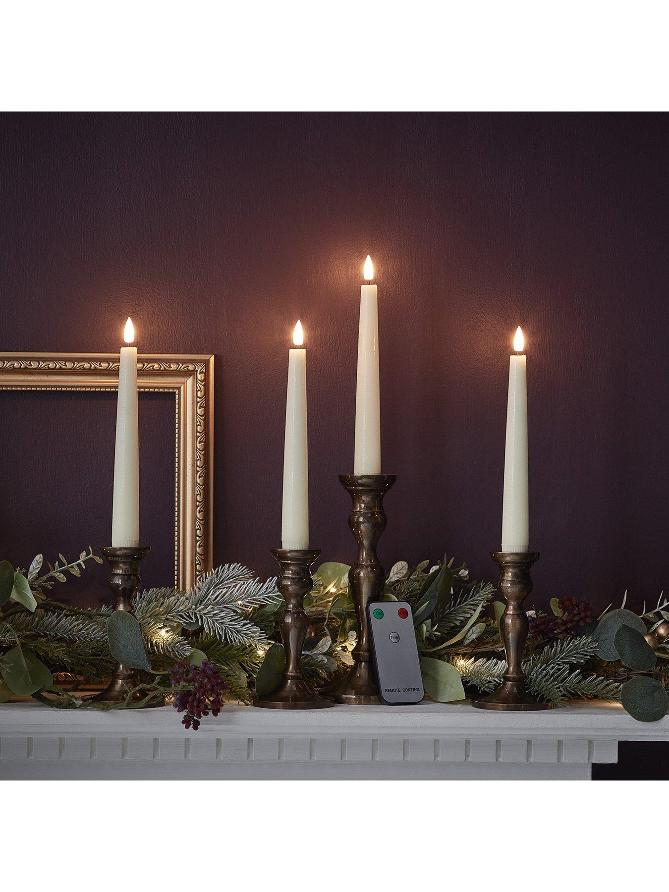  image of lights4fun-4-ivory-truglow-remote-control-short-led-taper-candles