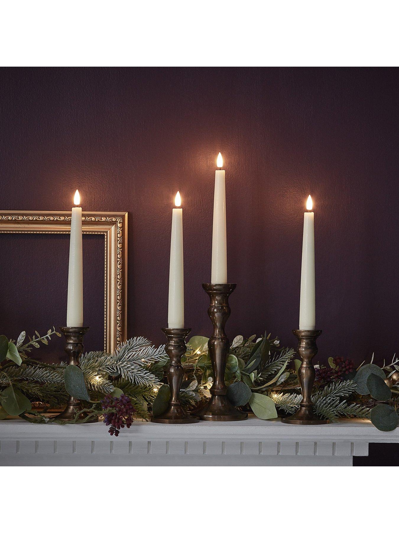  image of lights4fun-4-ivory-truglow-remote-control-short-led-taper-candles