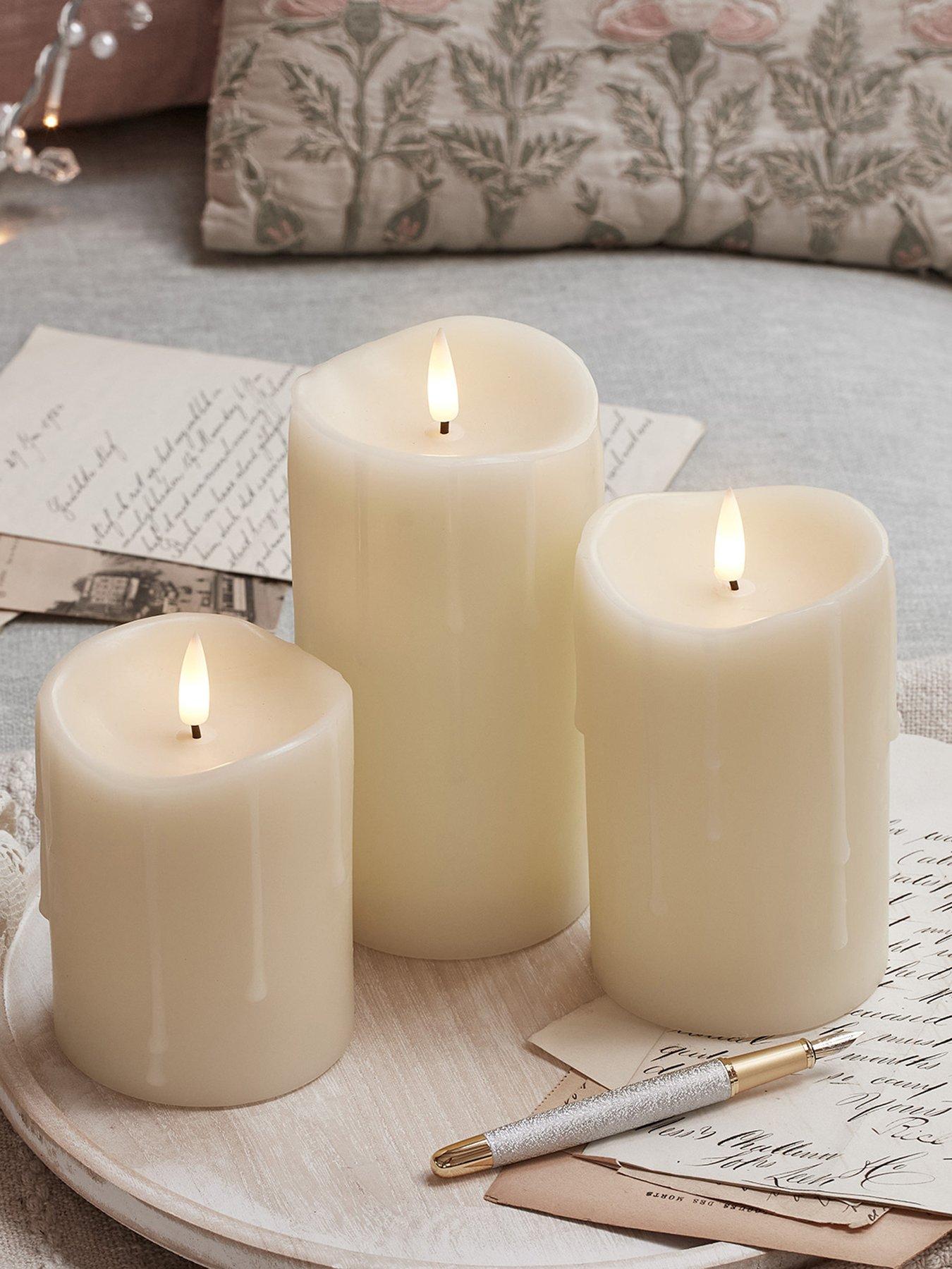  image of lights4fun-truglow-dripping-wax-led-pillar-candle-trio